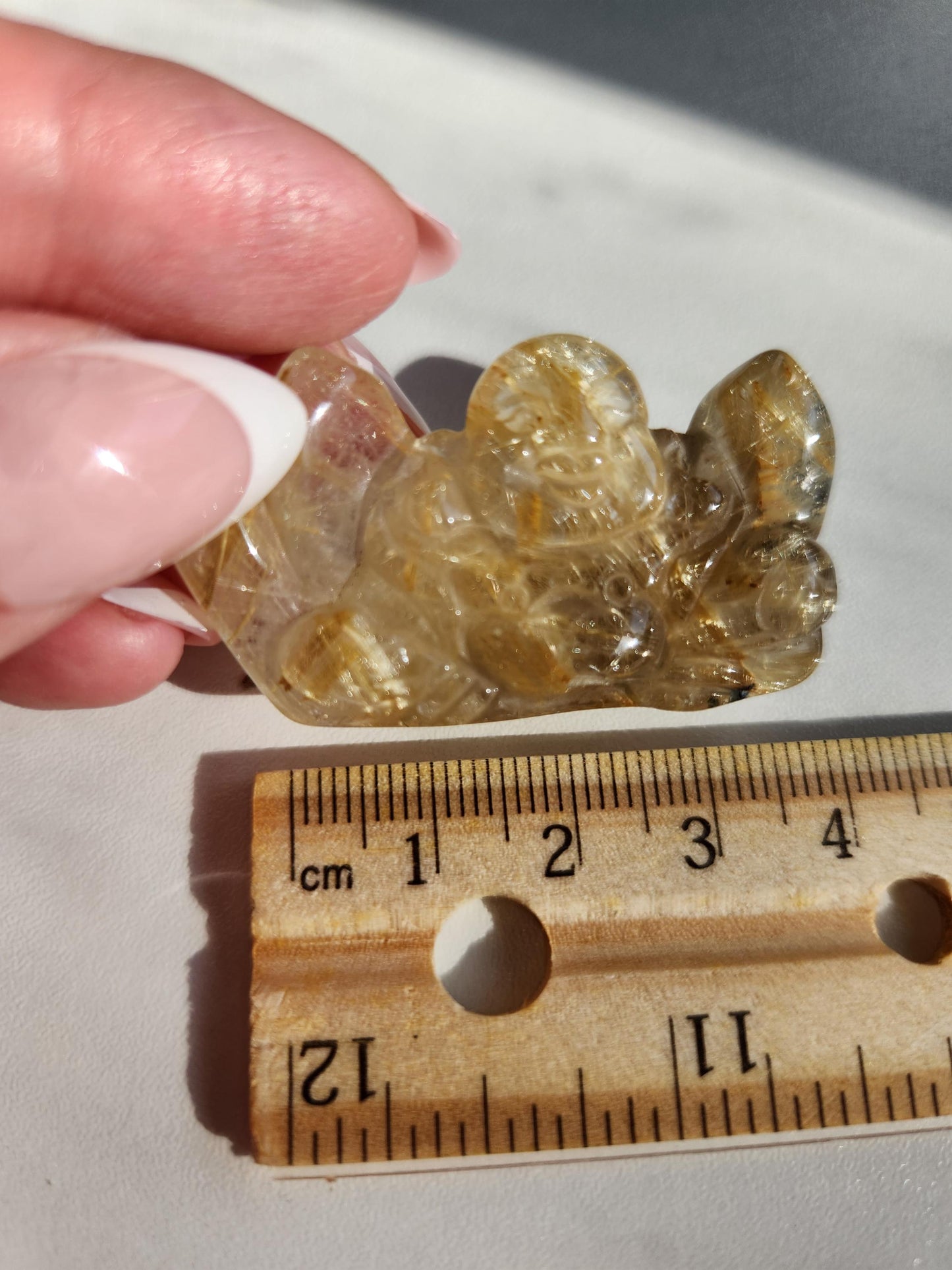 Golden rutile laughing buddha