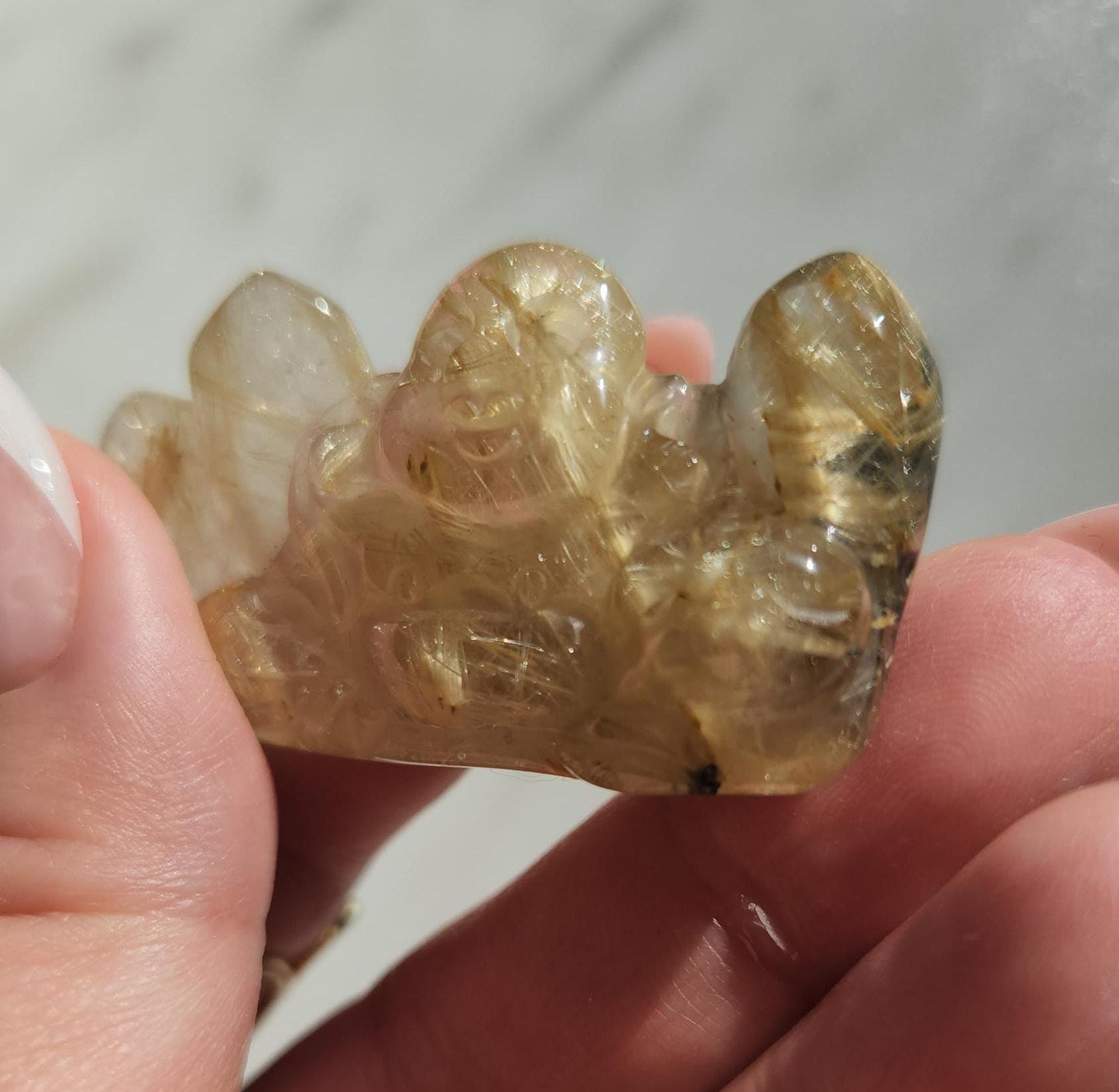Golden rutile laughing buddha
