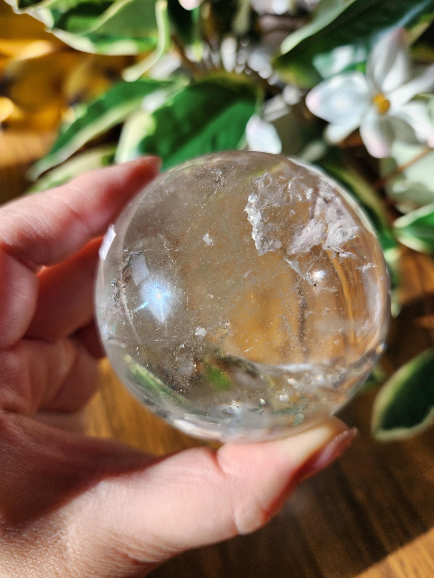 High quality lemurian clear quartz sphere with rainbows and inclusions, from the Tocantins mine in Brazil, authentic lemurian 146L 67.1mm