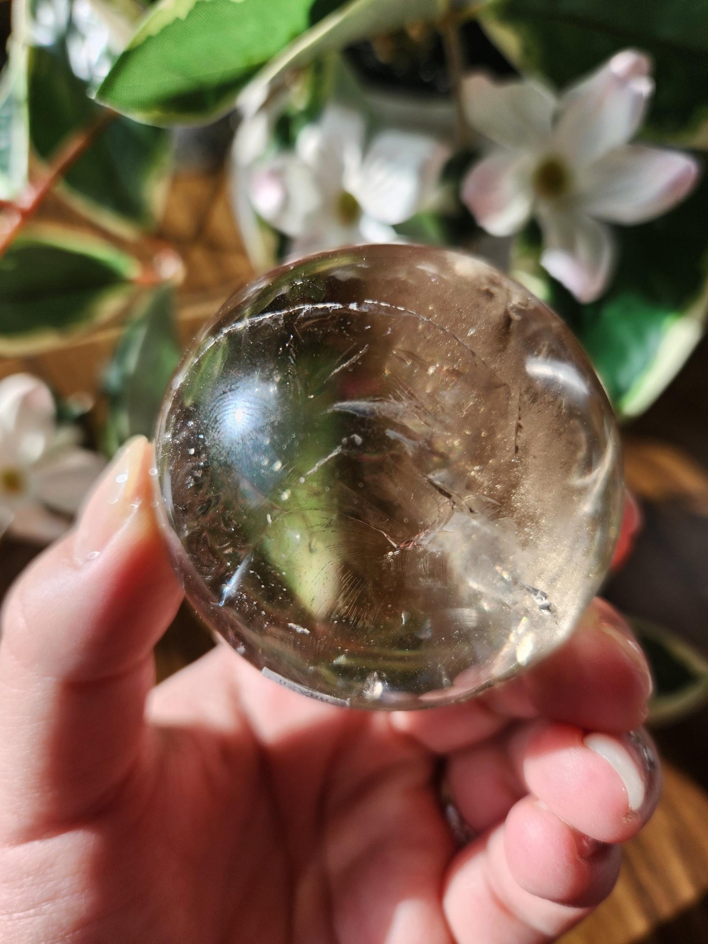 Amazing natural light smoky quartz sphere with beautiful rainbows and inclusions