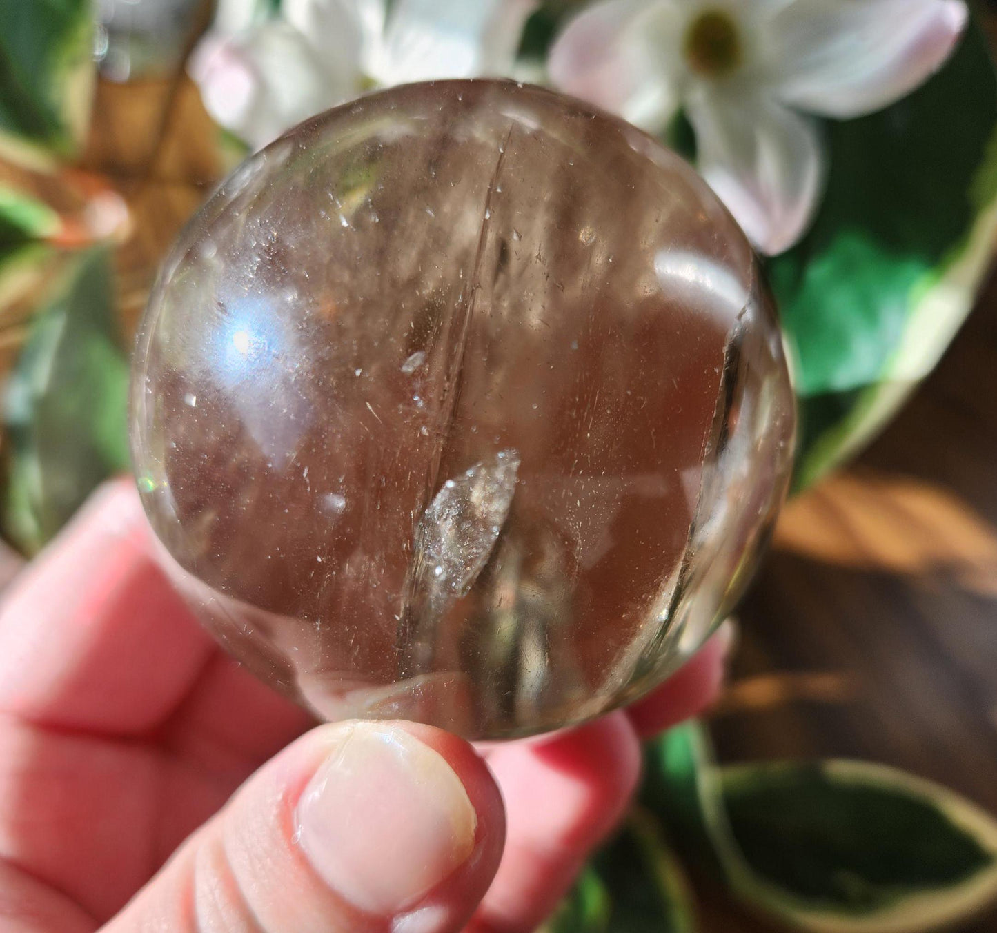 Amazing natural light smoky quartz sphere with beautiful rainbows and inclusions