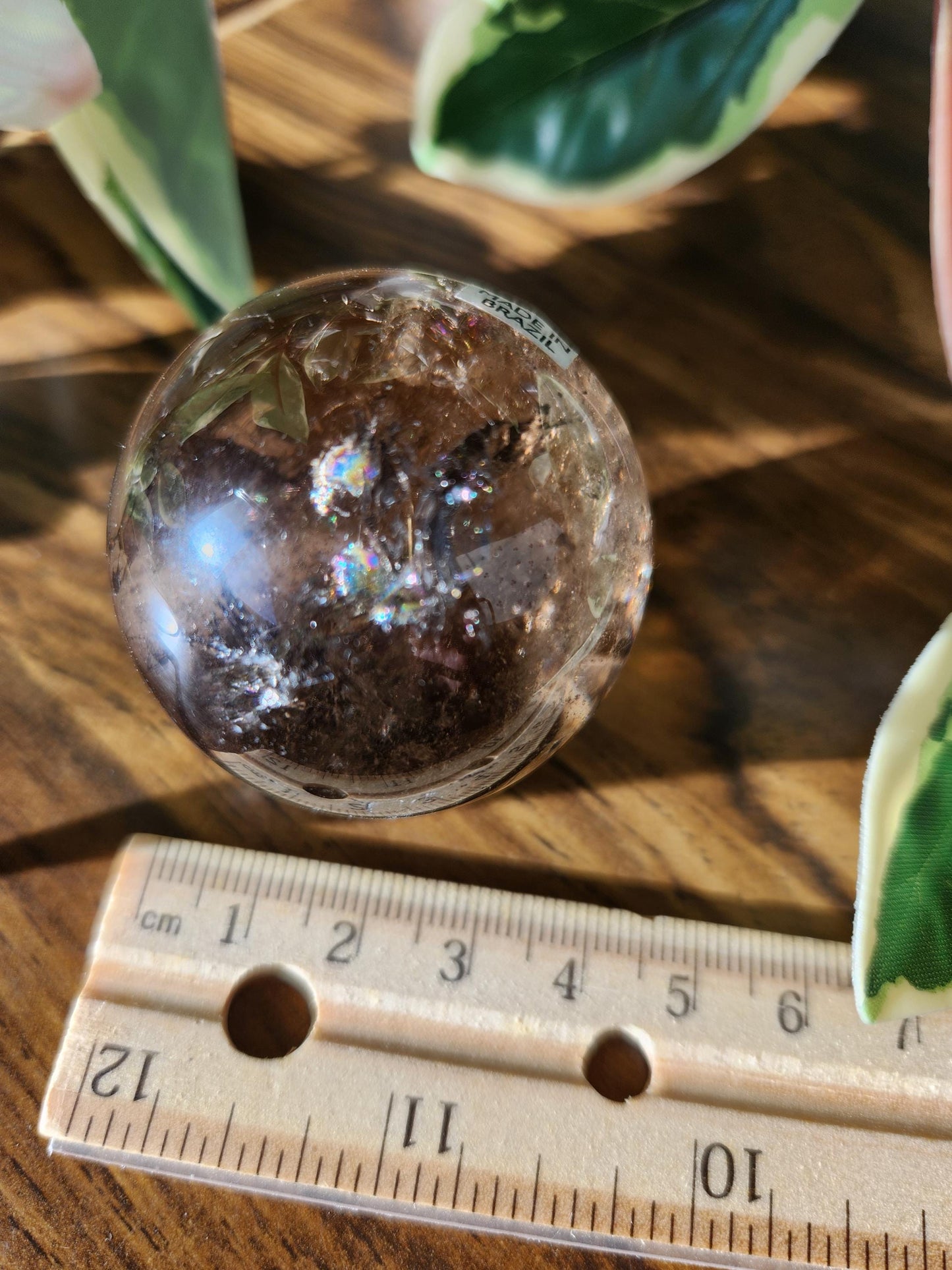 Smoky quartz sphere with rainbows