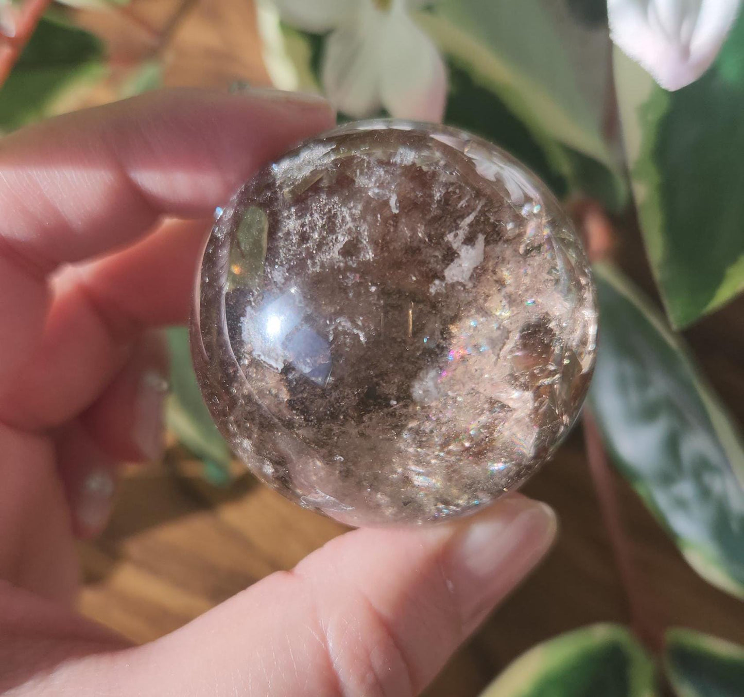 High quality natural smoky quartz sphere with many rainbows and inclusions