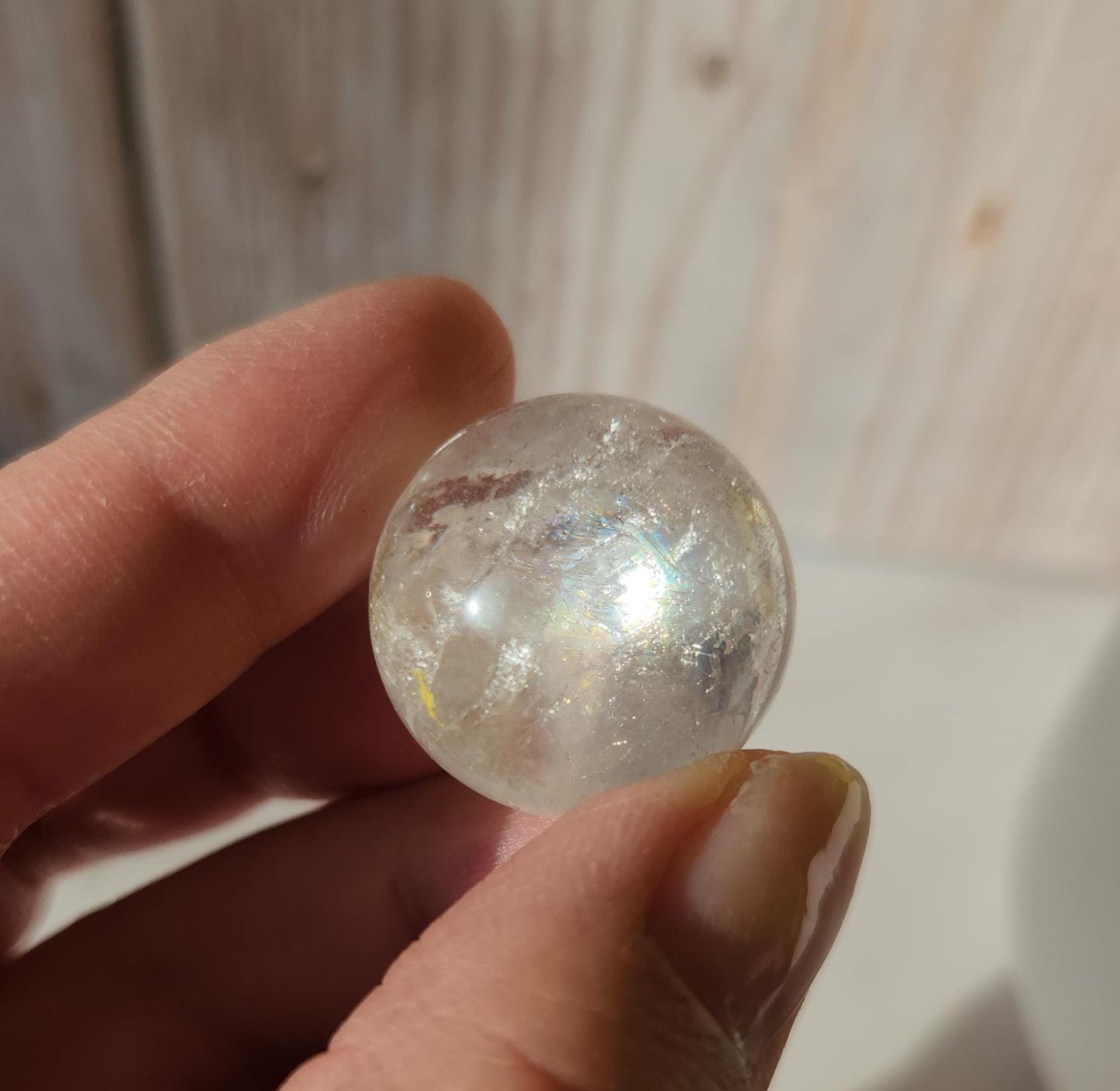 Rainbow clear quartz sphere with inclusions, from Brazil 22.5mm