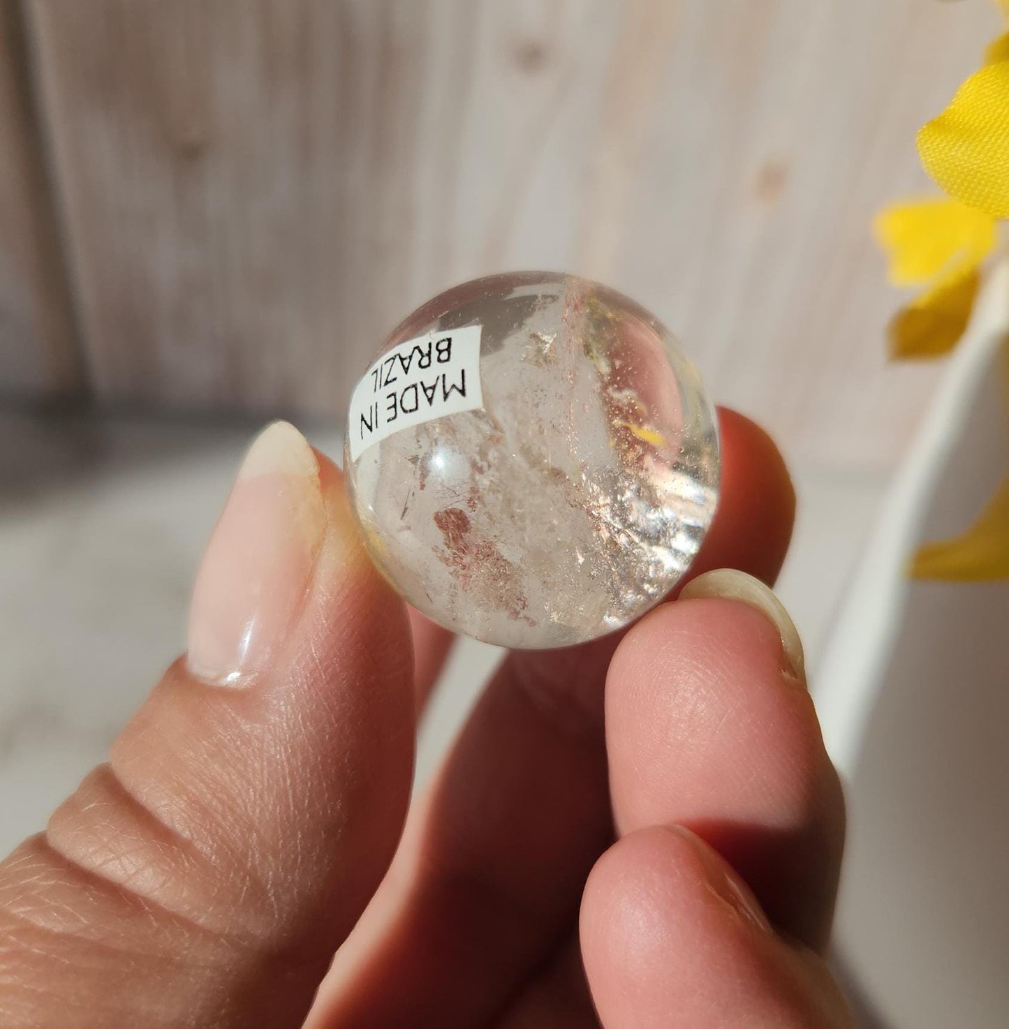 Rainbow clear quartz sphere with inclusions, from Brazil 22.5mm
