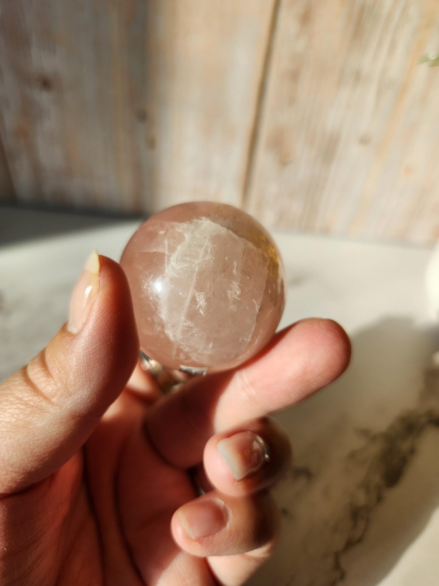 Juicy rose quartz sphere with inclusions, rainbows, and asterism from Brazil 38.5mm