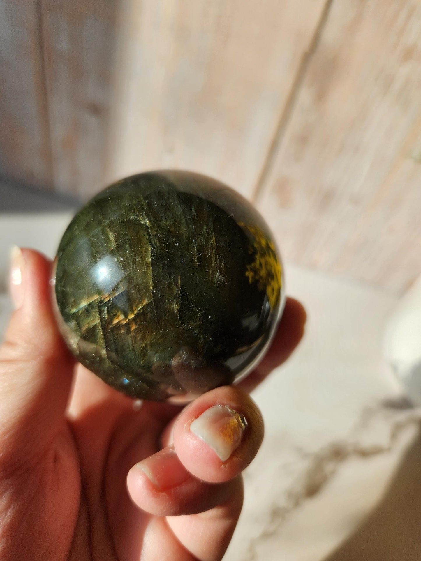 Beautiful labradorite sphere with pink and orange sunset flash and hints of blue, 54.4mm