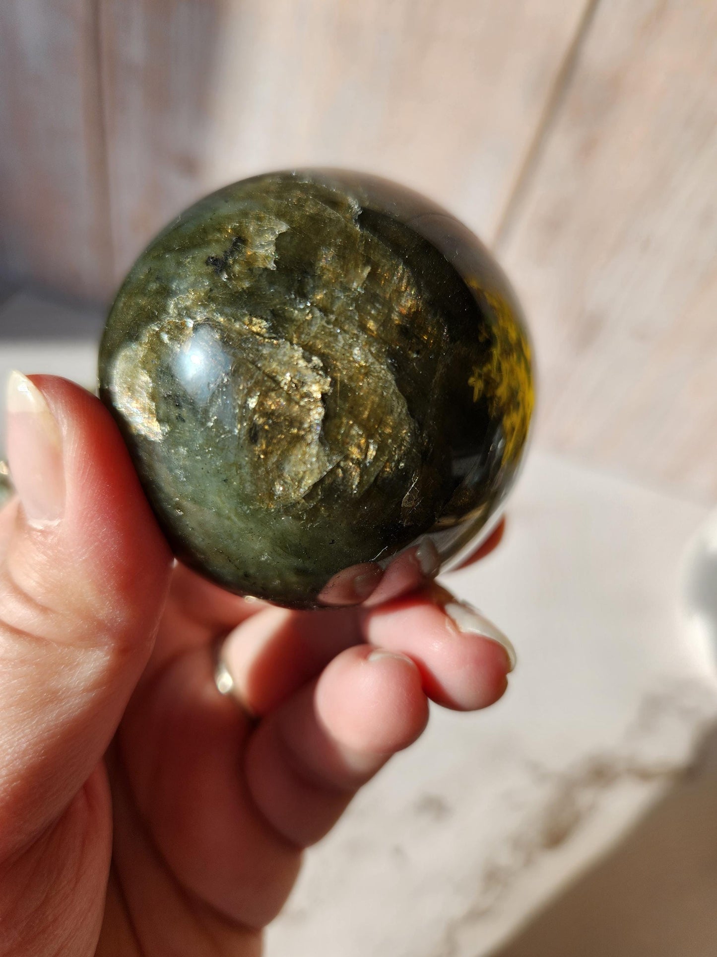 Beautiful labradorite sphere with pink and orange sunset flash and hints of blue, 54.4mm