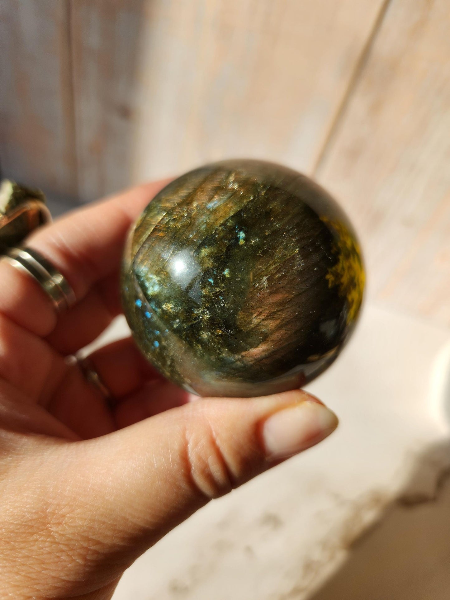 Beautiful labradorite sphere with pink and orange sunset flash and hints of blue, 54.4mm