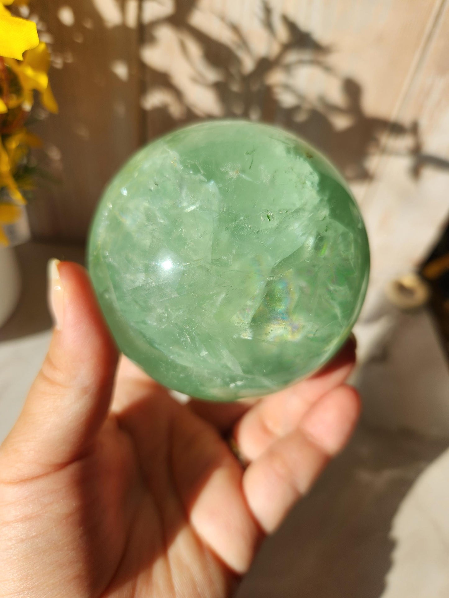 Beautiful large natural green fluorite sphere with many rainbows and inclusions 73.4mm