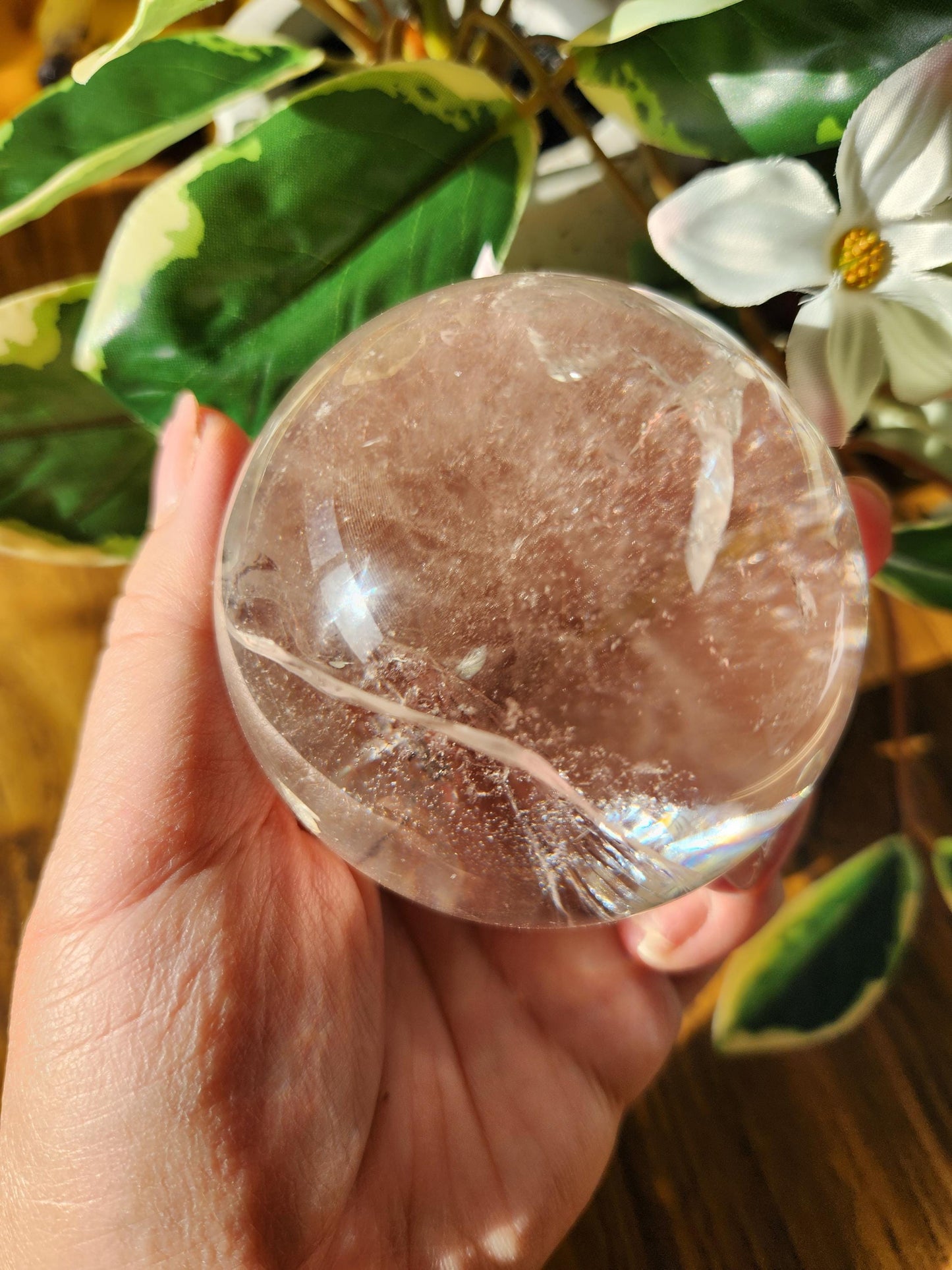High quality lemurian clear quartz sphere with rainbows and inclusions, from the Tocantins mine in Brazil, authentic lemurian 146L 67.1mm