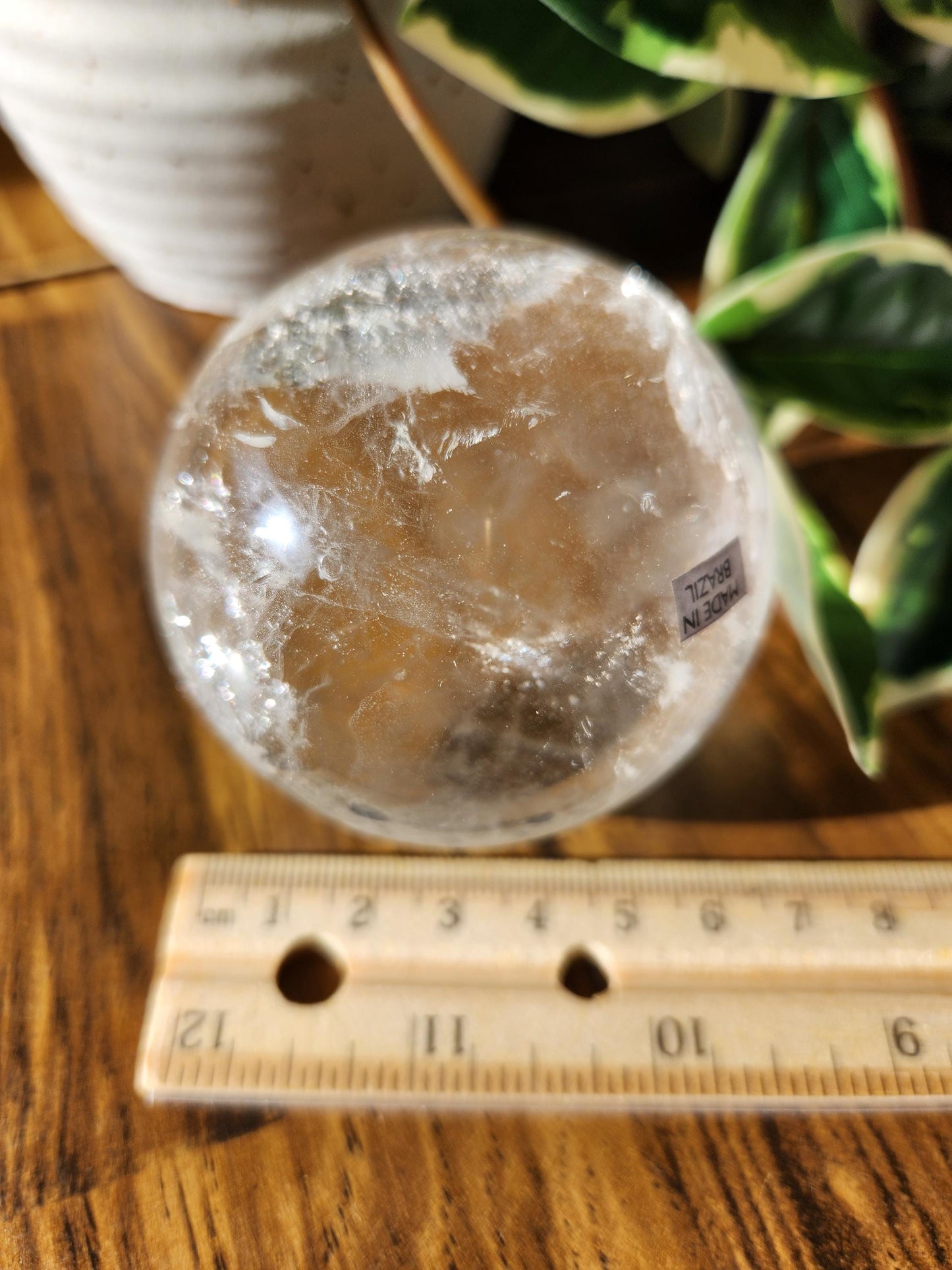 High quality lemurian clear quartz sphere with rainbows and inclusions, from the Tocantins mine in Brazil, authentic lemurian 146L 67.1mm