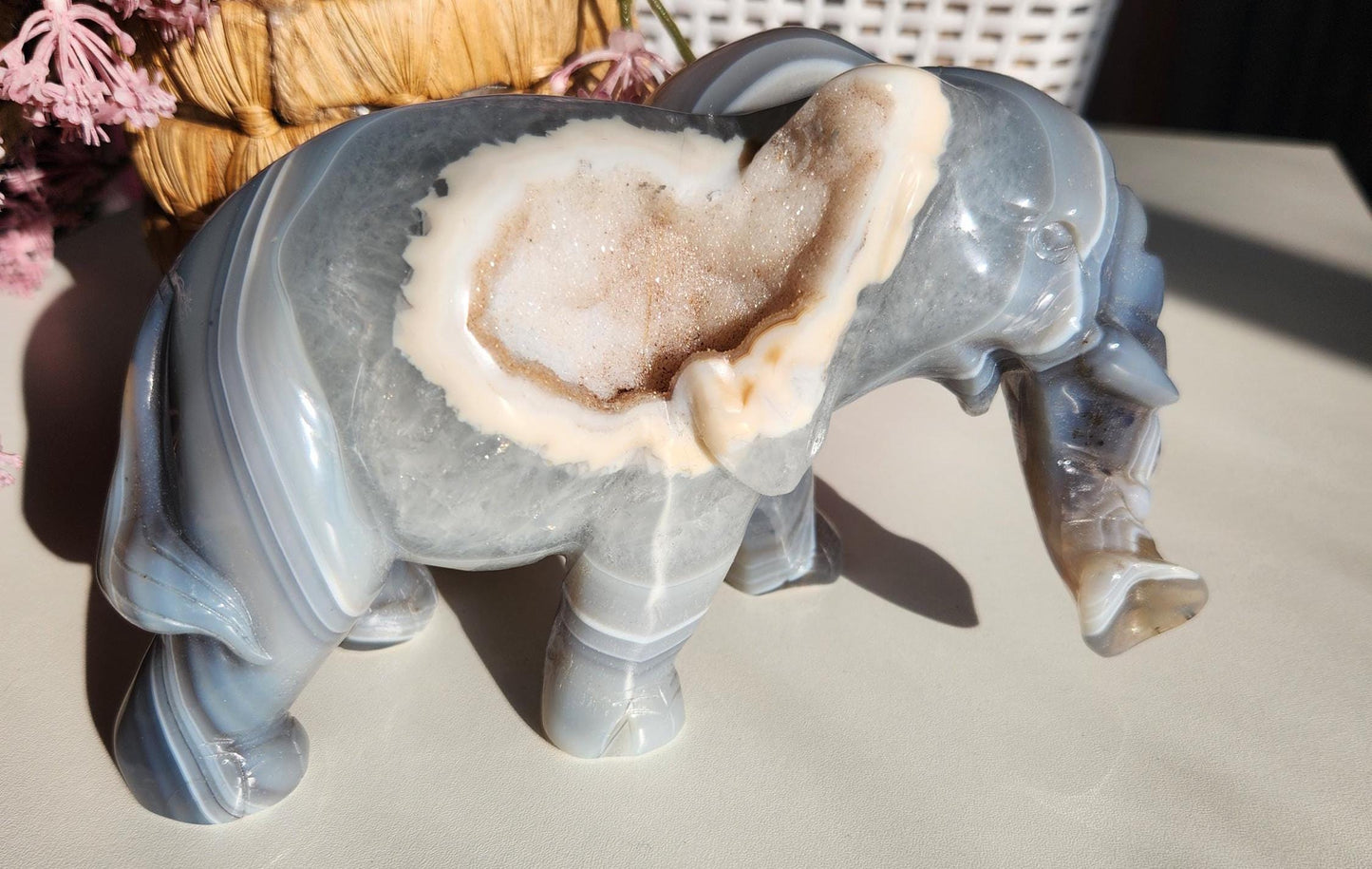 Beautiful master hand carved elephant agate with a sparkly white druzy, natural, nice banding, quartz