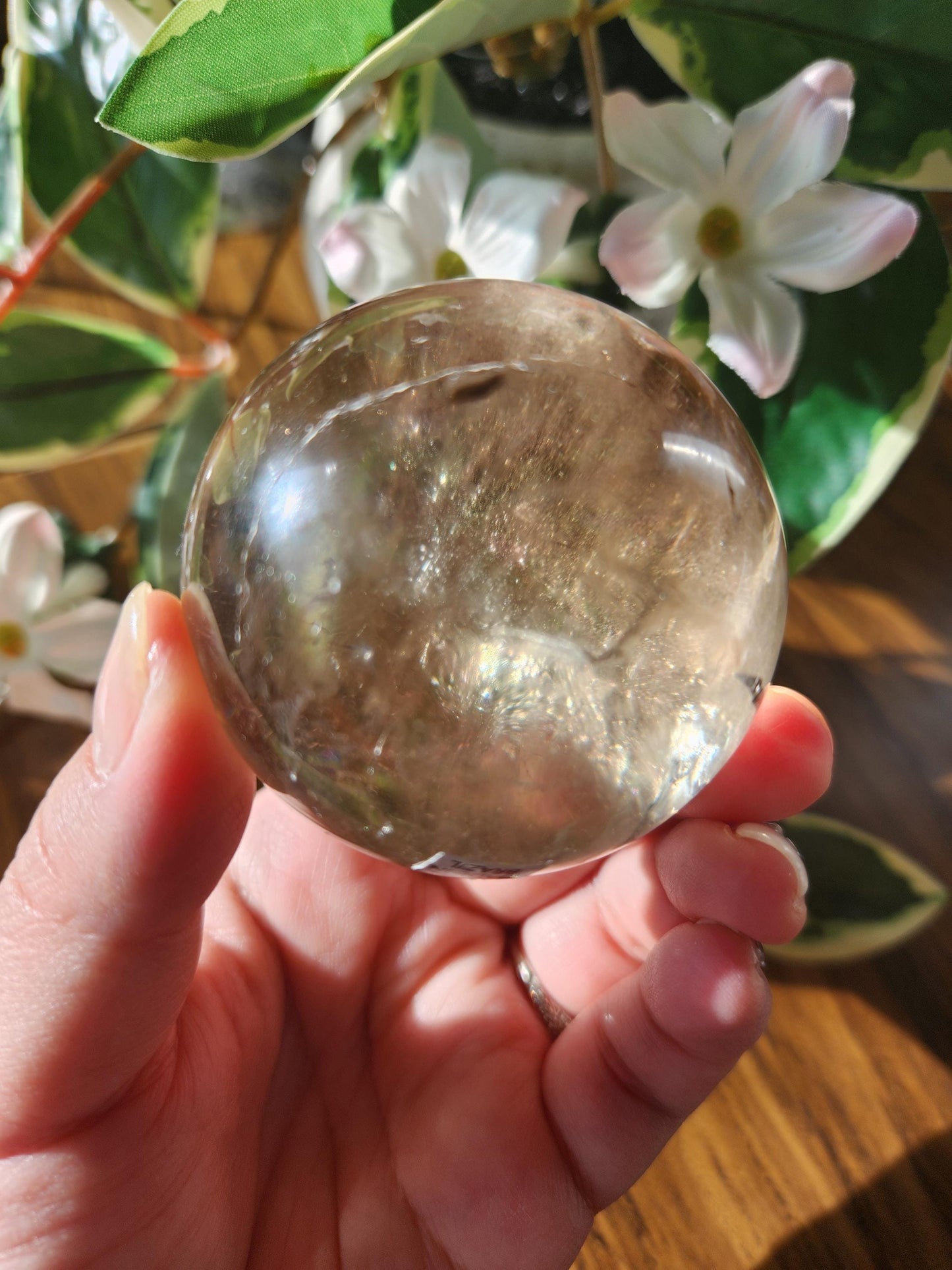 Amazing natural light smoky quartz sphere with beautiful rainbows and inclusions