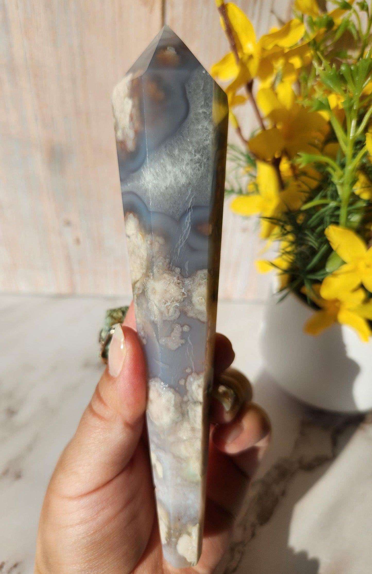 Natural black flower agate wand with stand, has quartz, black chalcedony, a touch of green, and beautiful agate banding from Madagascar