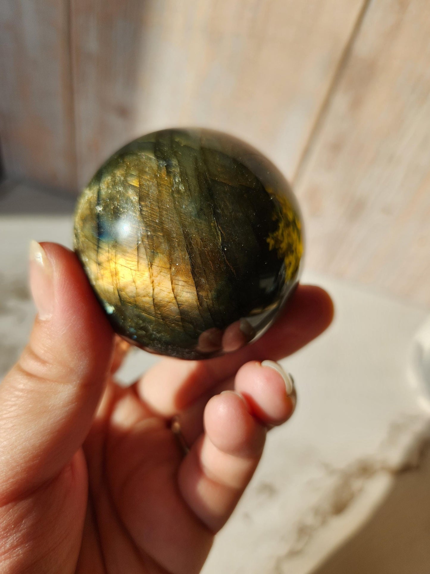 Beautiful labradorite sphere with pink and orange sunset flash and hints of blue, 54.4mm