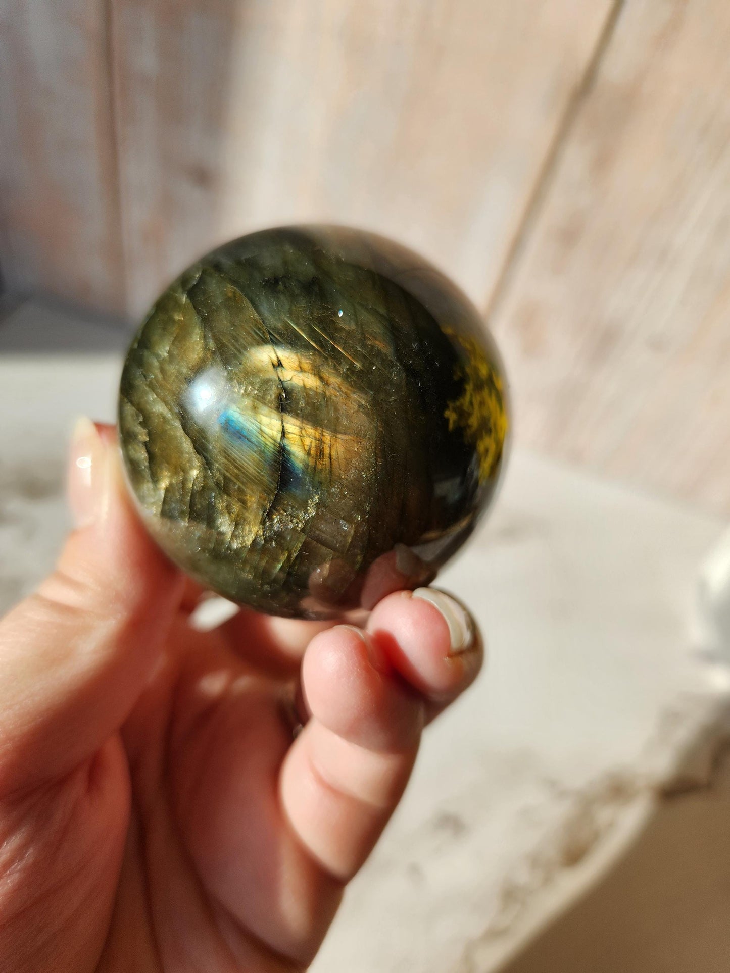 Beautiful labradorite sphere with pink and orange sunset flash and hints of blue, 54.4mm