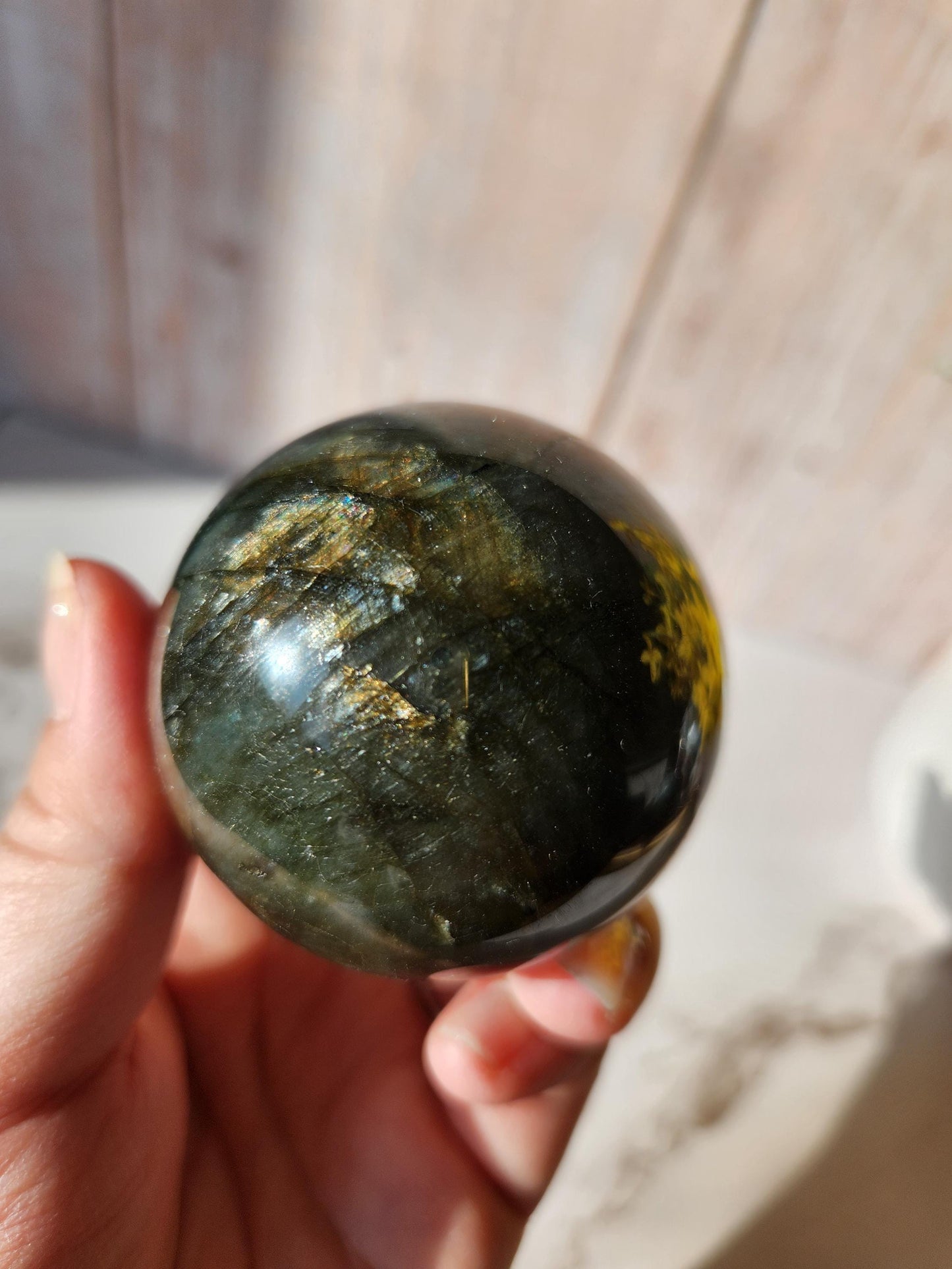 Beautiful labradorite sphere with pink and orange sunset flash and hints of blue, 54.4mm