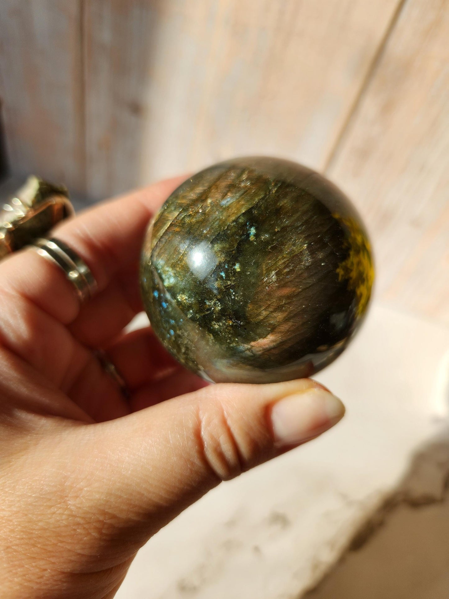 Beautiful labradorite sphere with pink and orange sunset flash and hints of blue, 54.4mm