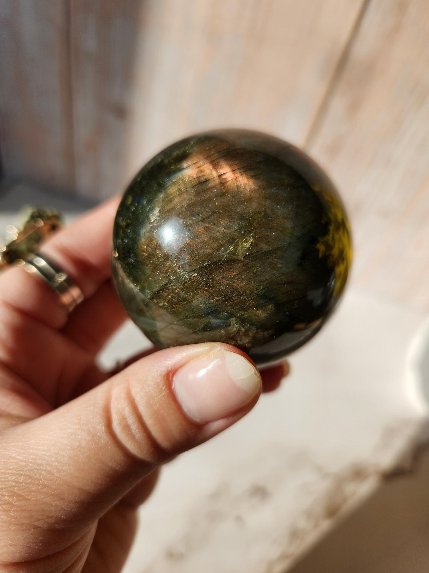 Beautiful labradorite sphere with pink and orange sunset flash and hints of blue, 54.4mm