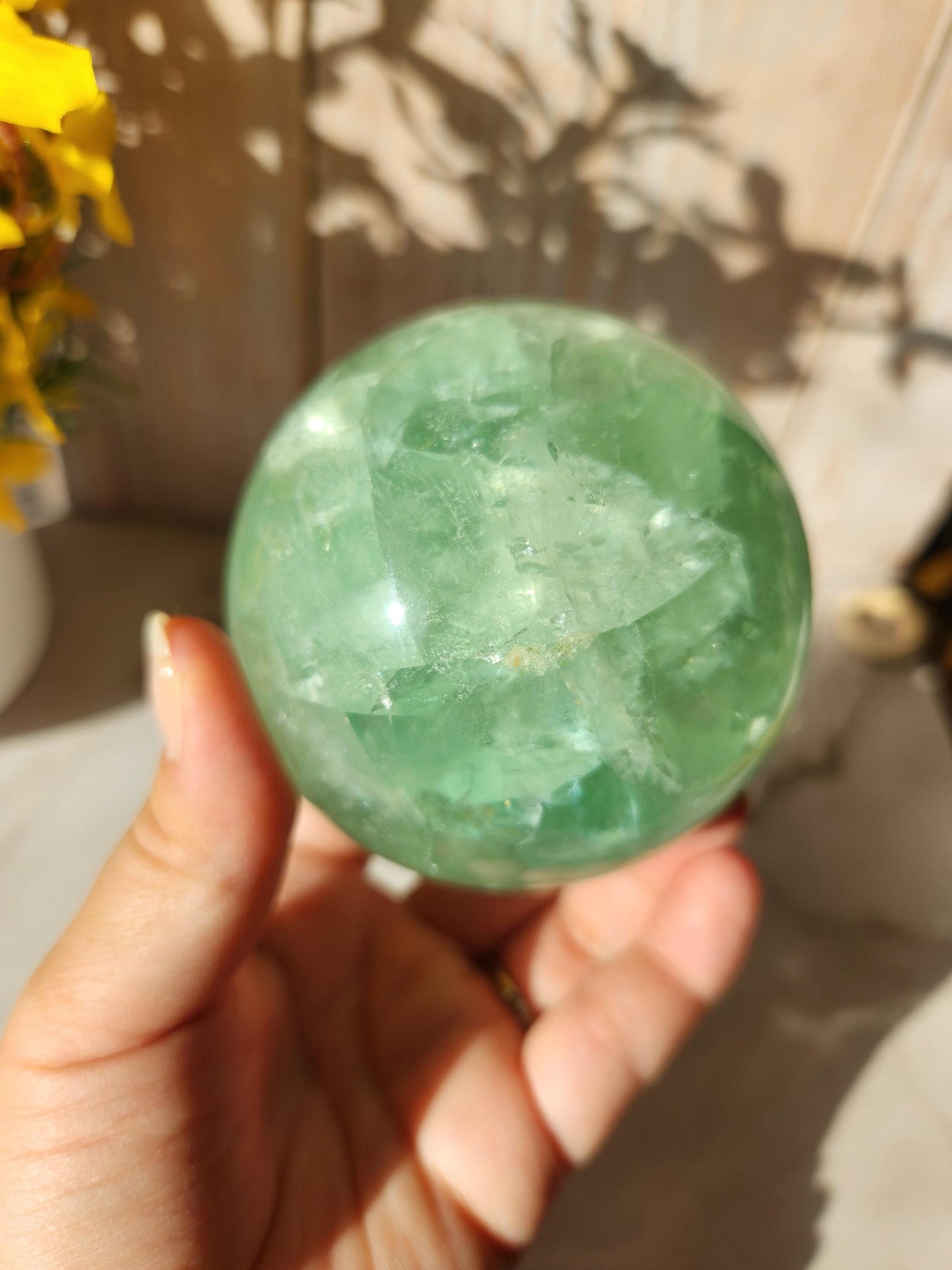 Beautiful large natural green fluorite sphere with many rainbows and inclusions 73.4mm
