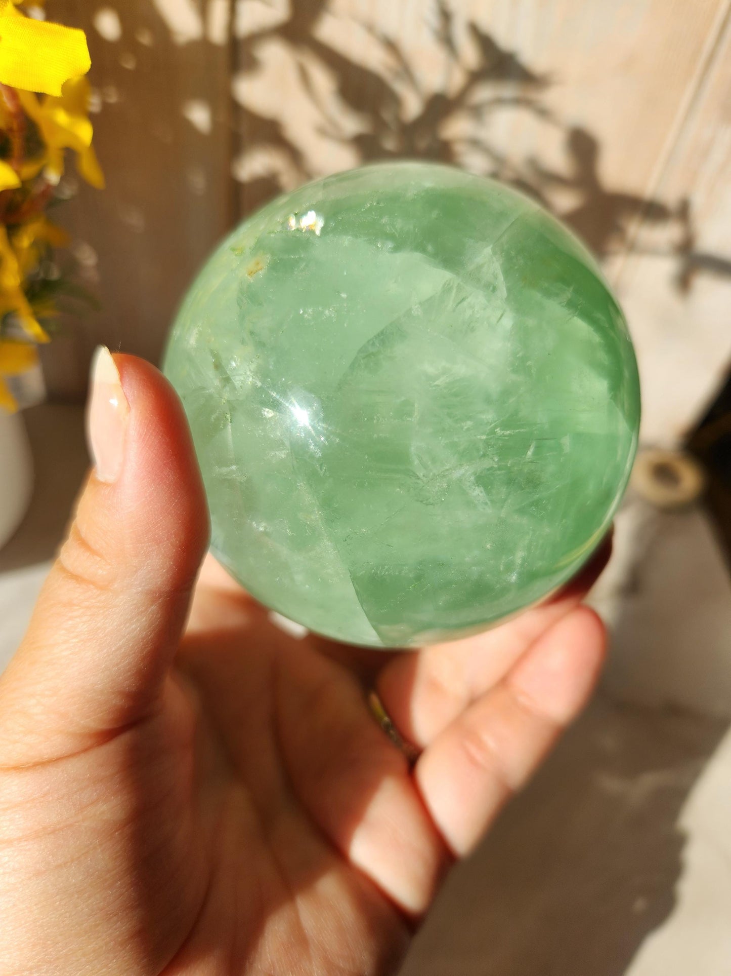 Beautiful large natural green fluorite sphere with many rainbows and inclusions 73.4mm