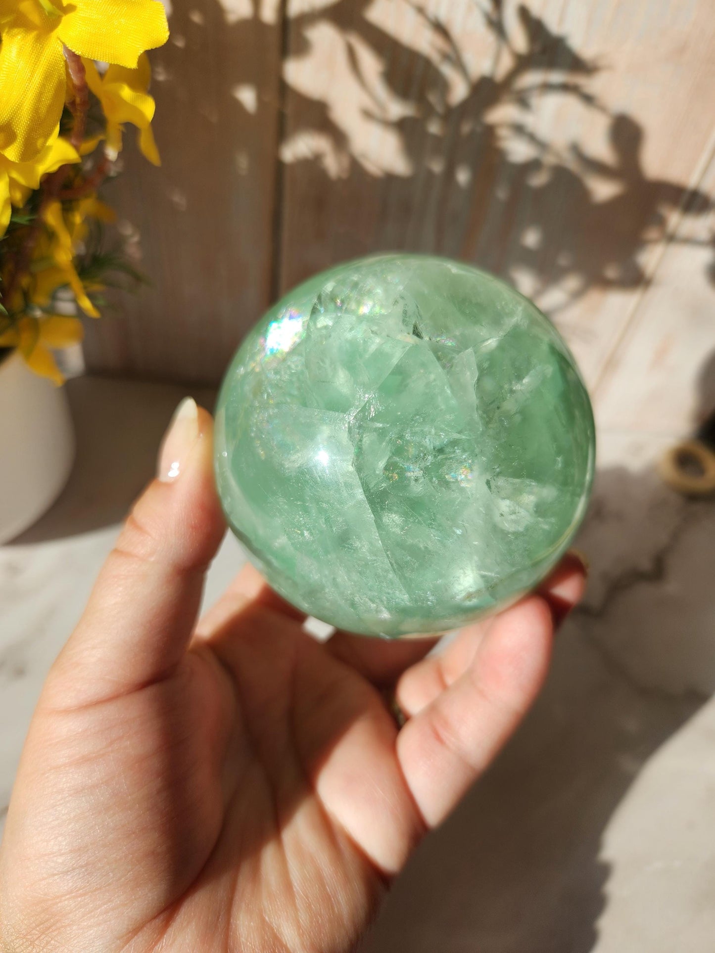 Beautiful large natural green fluorite sphere with many rainbows and inclusions 73.4mm