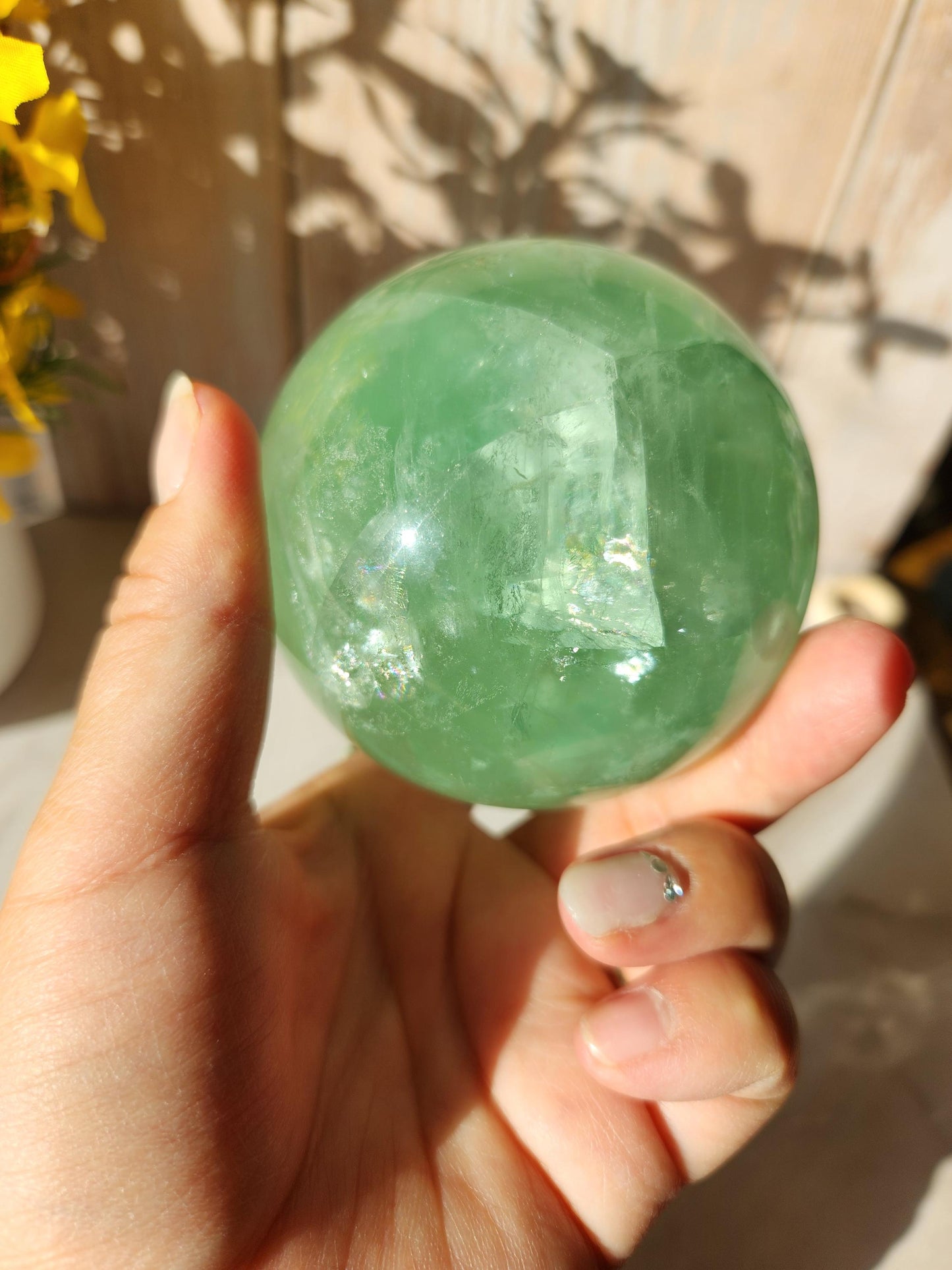Beautiful large natural green fluorite sphere with many rainbows and inclusions 73.4mm