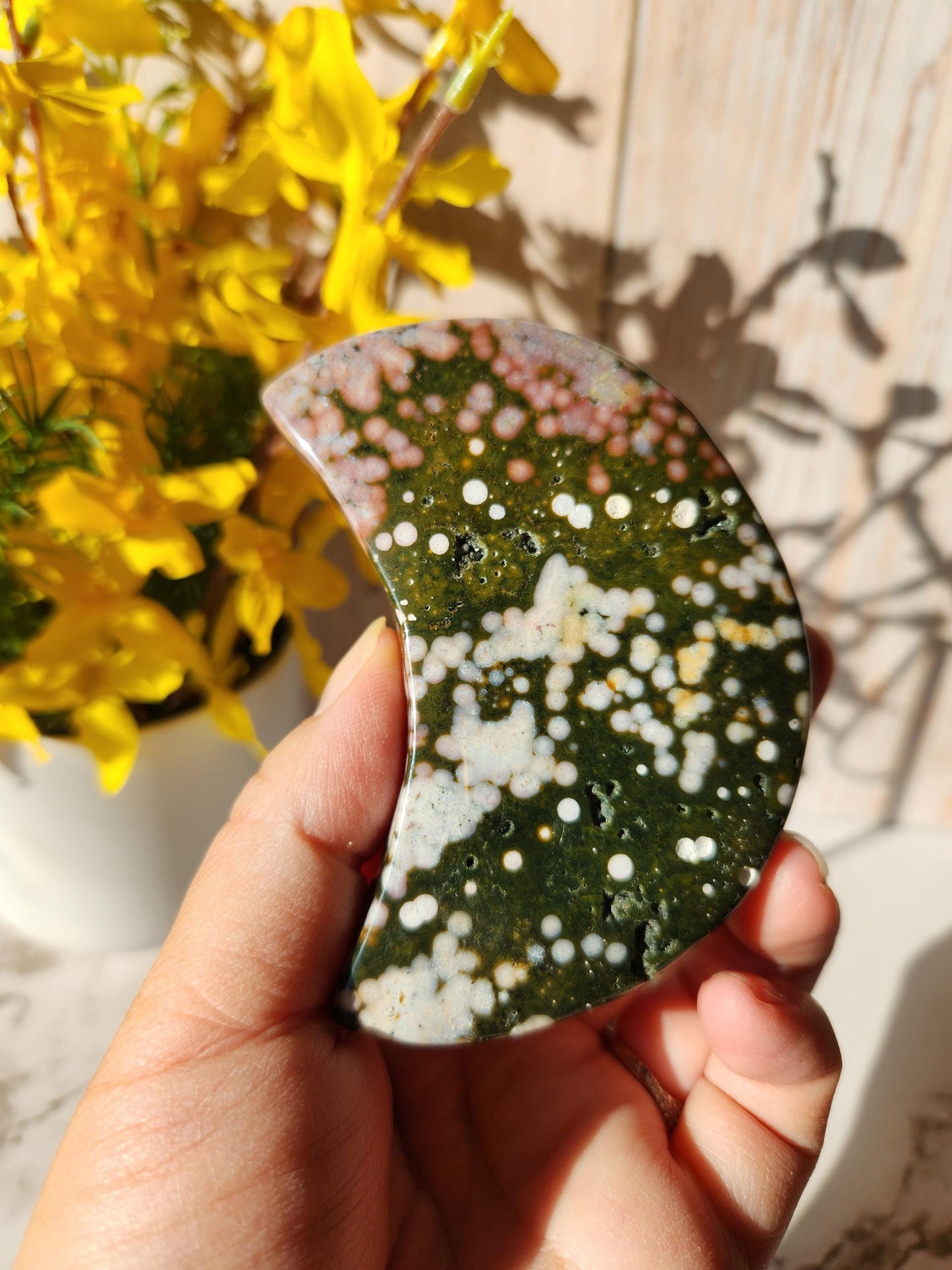 Pretty ocean jasper moon with beautiful colors, stand included