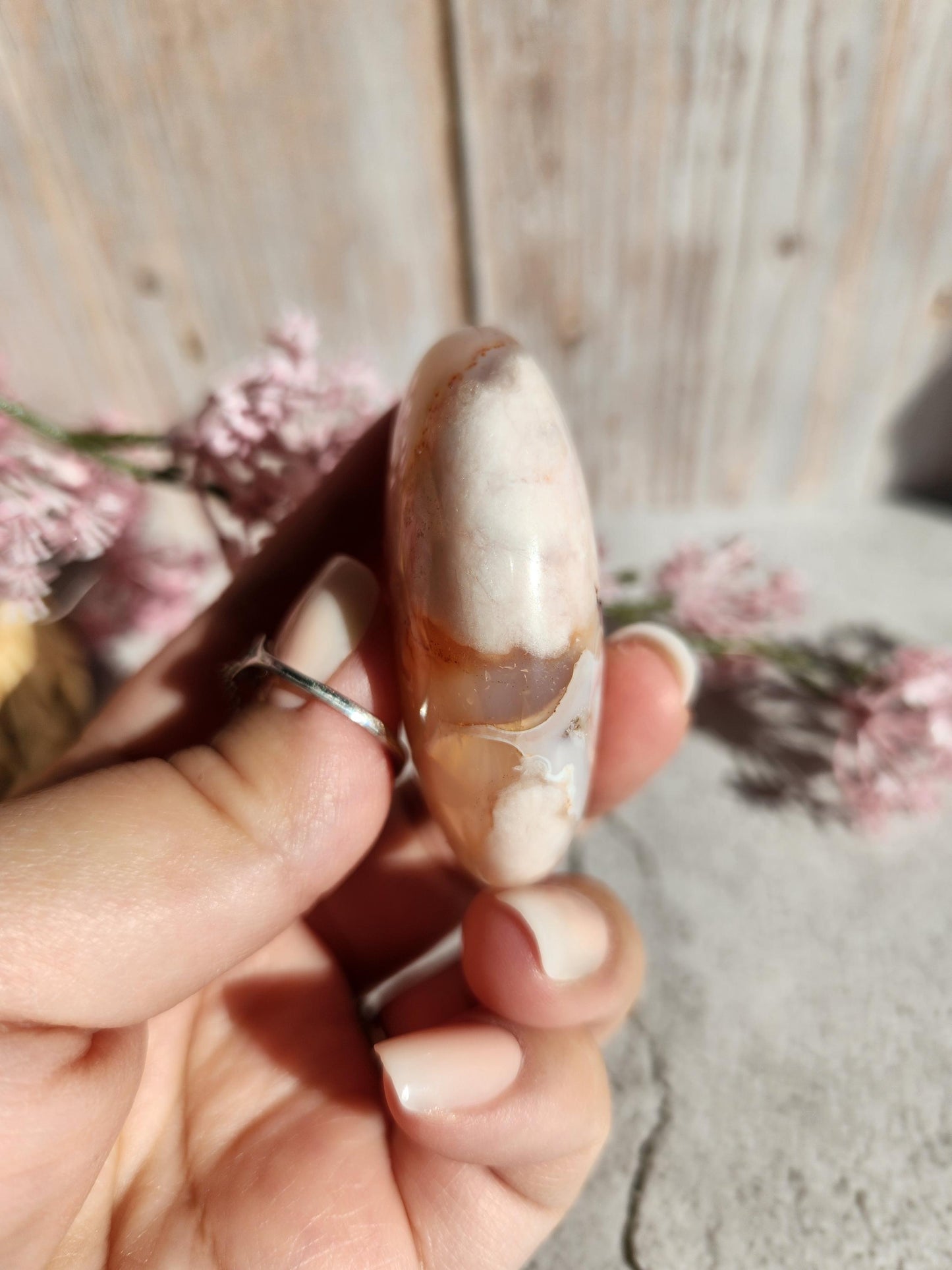 Beautiful natural carnelian flower agate palm stone with sparkly flowers from Madagascar, cherry blossoms