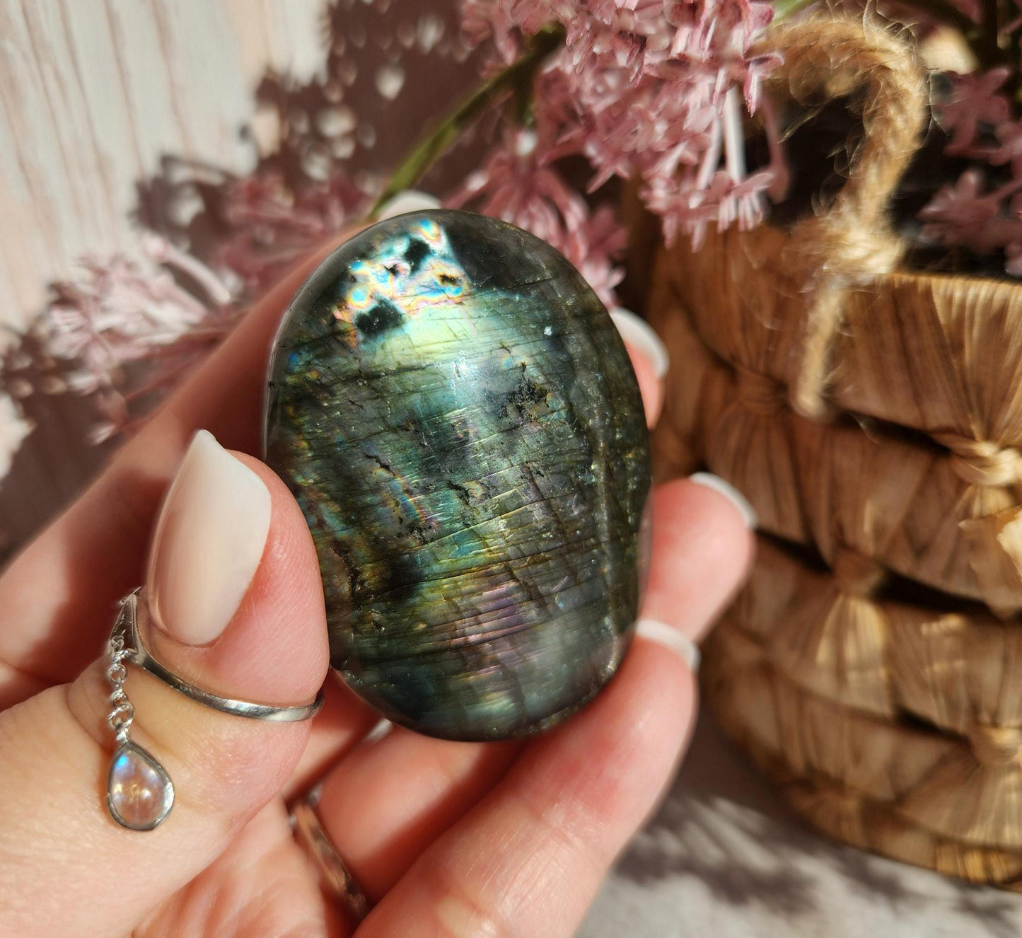 Beautiful bright silver and purple labradorite palm stone from Finland