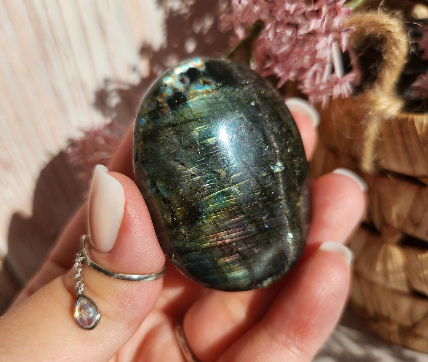 Beautiful bright silver and purple labradorite palm stone from Finland