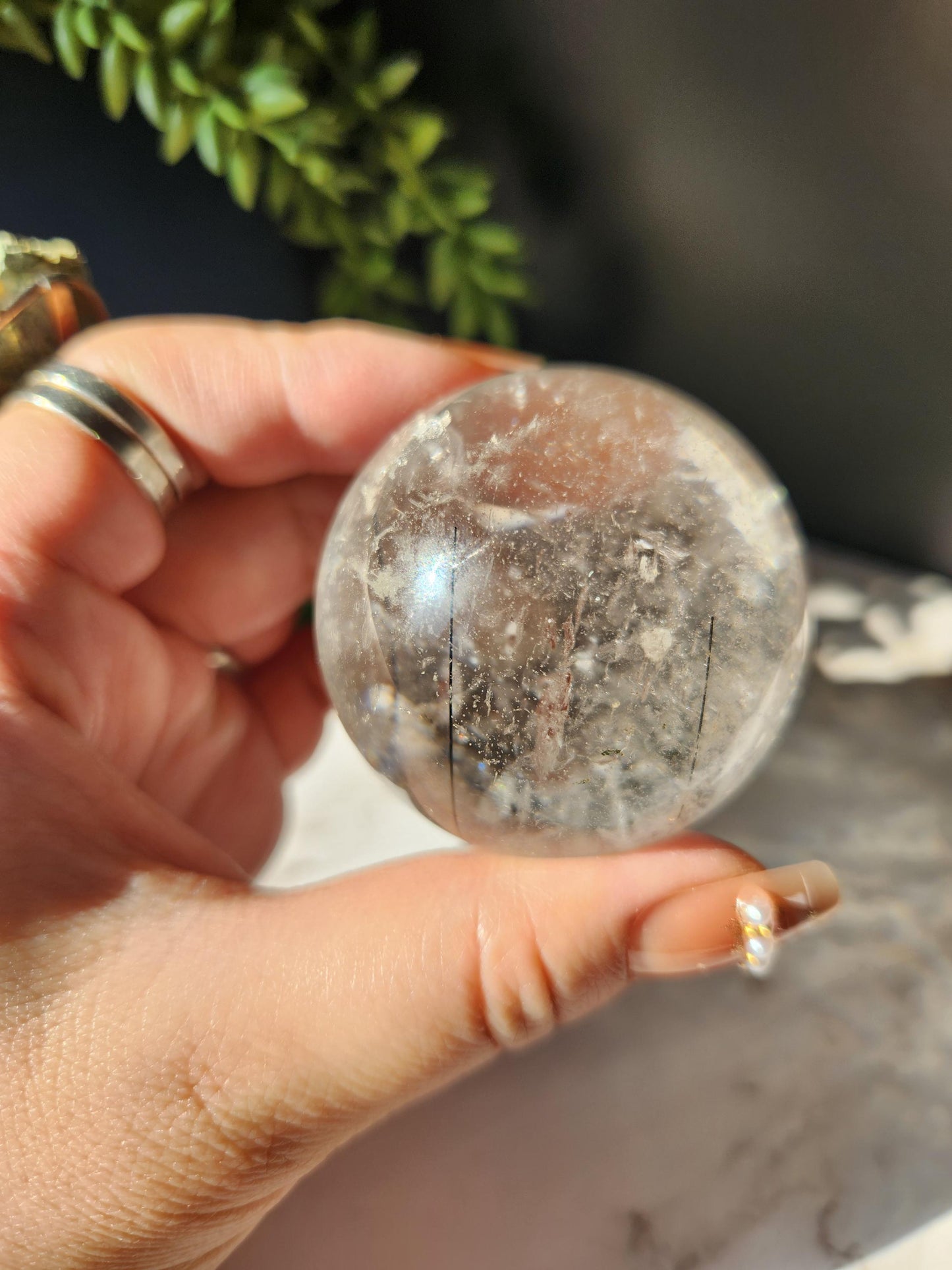 High quality black tourmaline in quartz sphere with rainbows.