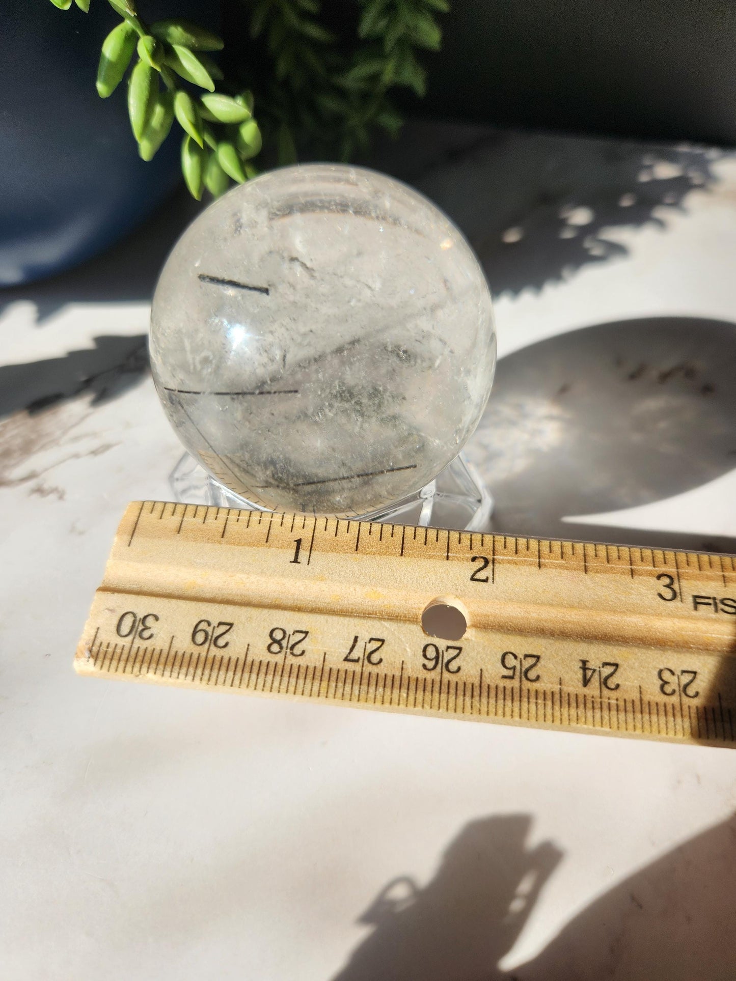 High quality black tourmaline in quartz sphere with rainbows.