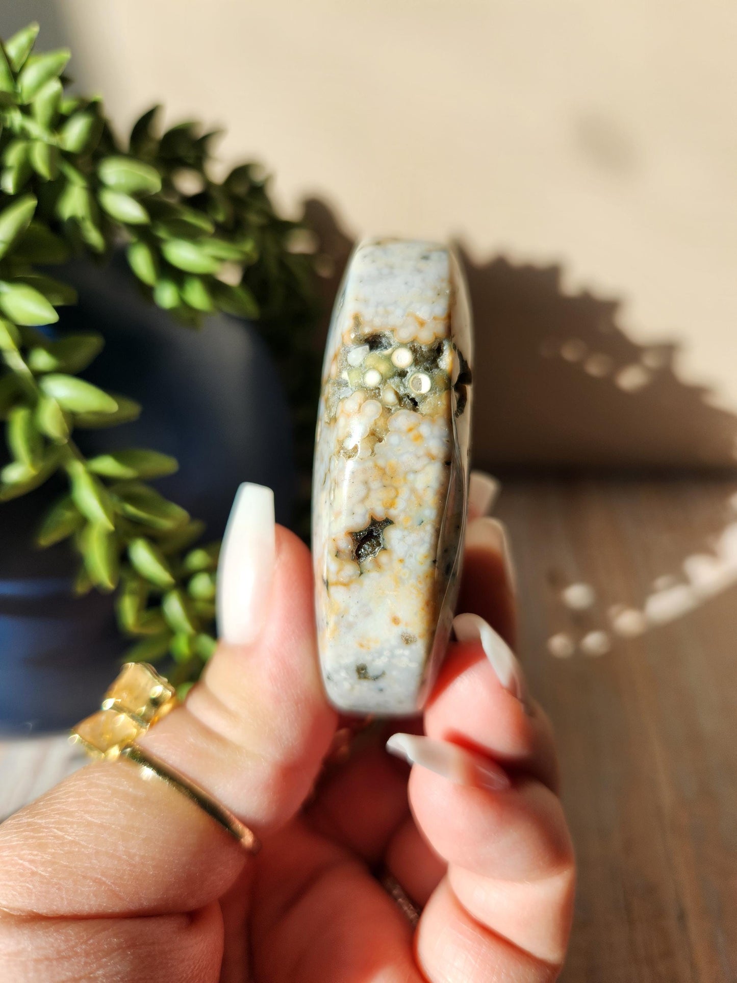 Pretty ocean jasper palm stone with druzy