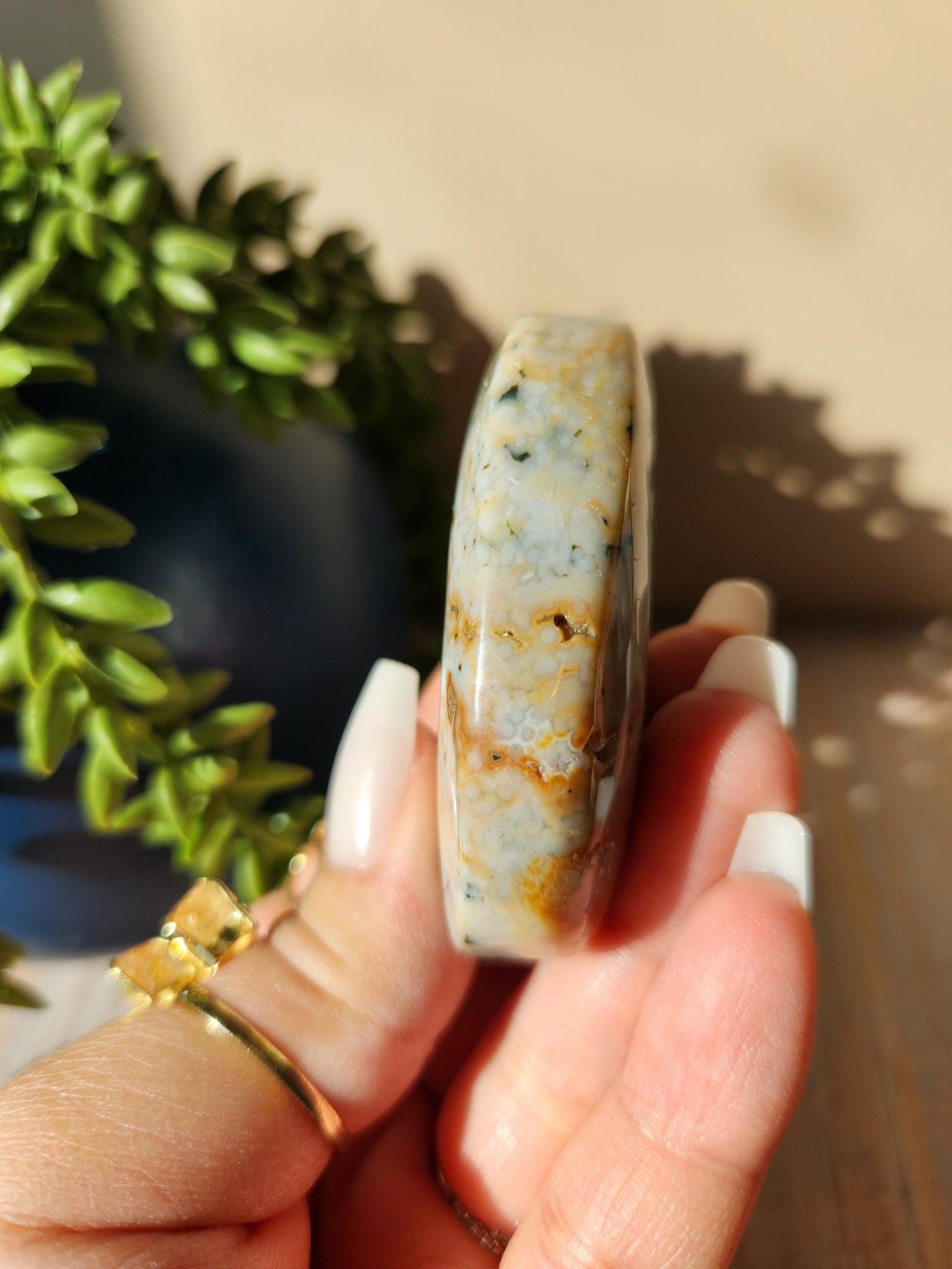 Pretty ocean jasper palm stone with druzy