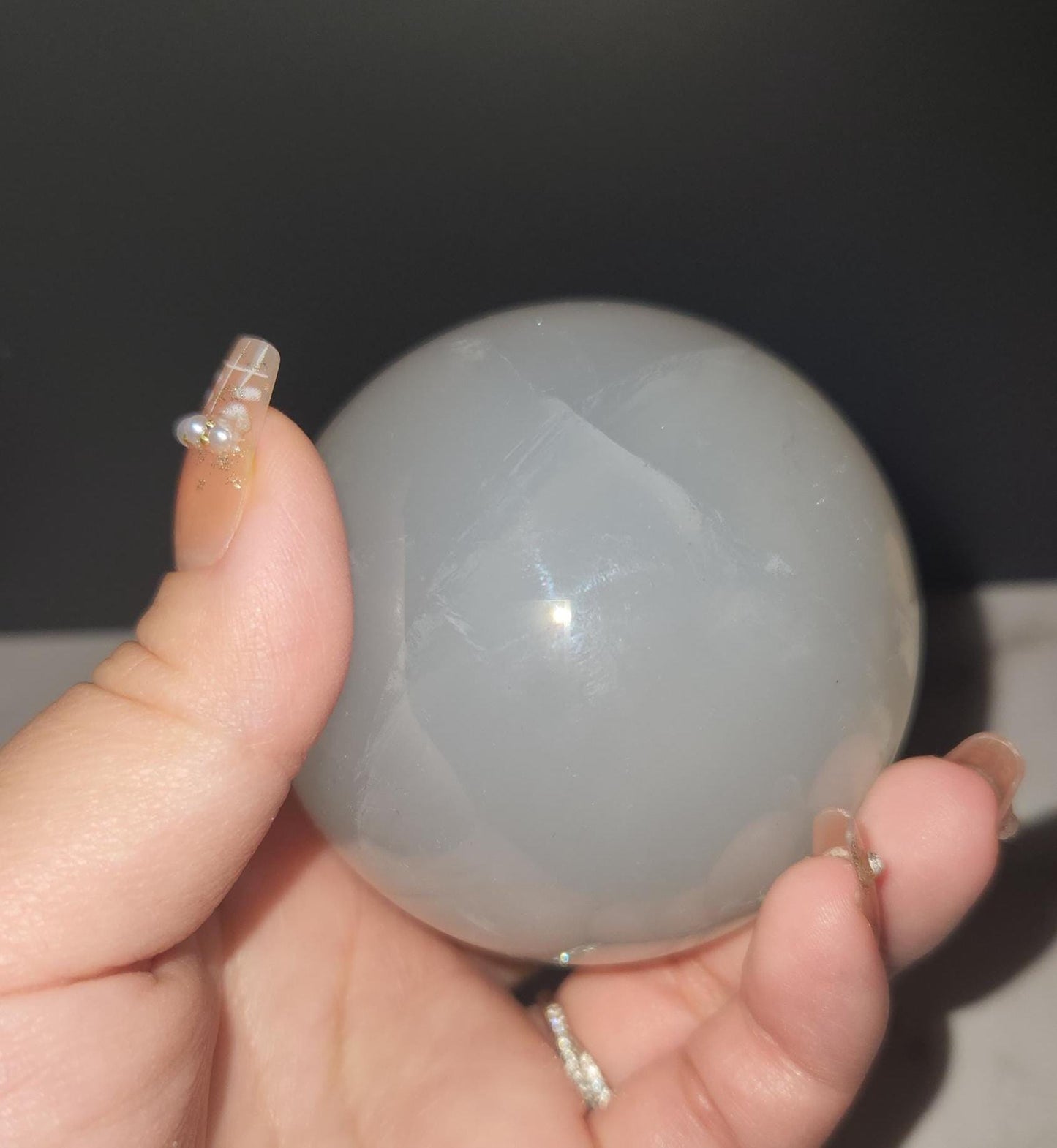 Beautiful blue rose quartz sphere with inclusions and rainbows 67.2mm