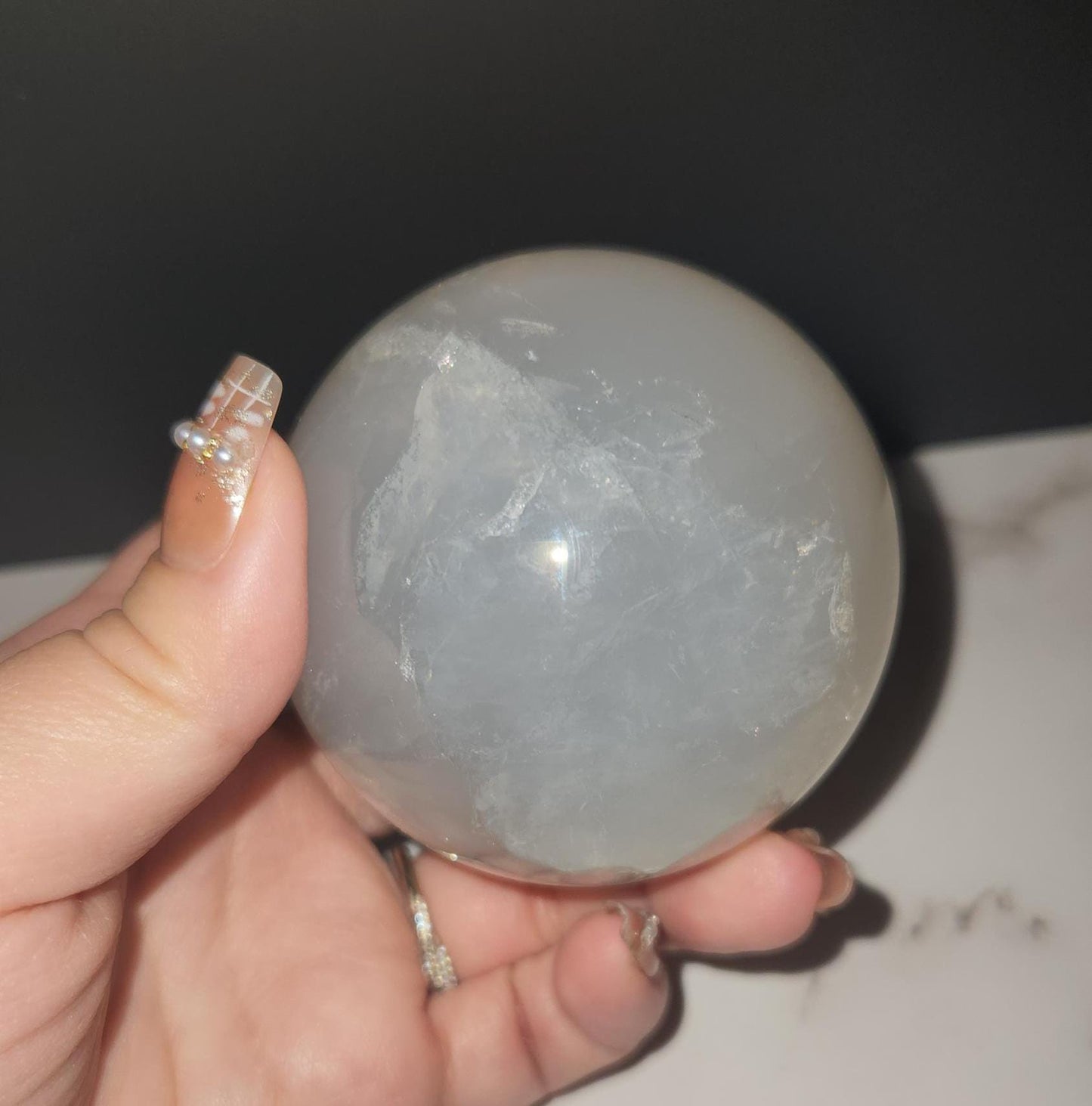 Beautiful blue rose quartz sphere with inclusions and rainbows 67.2mm