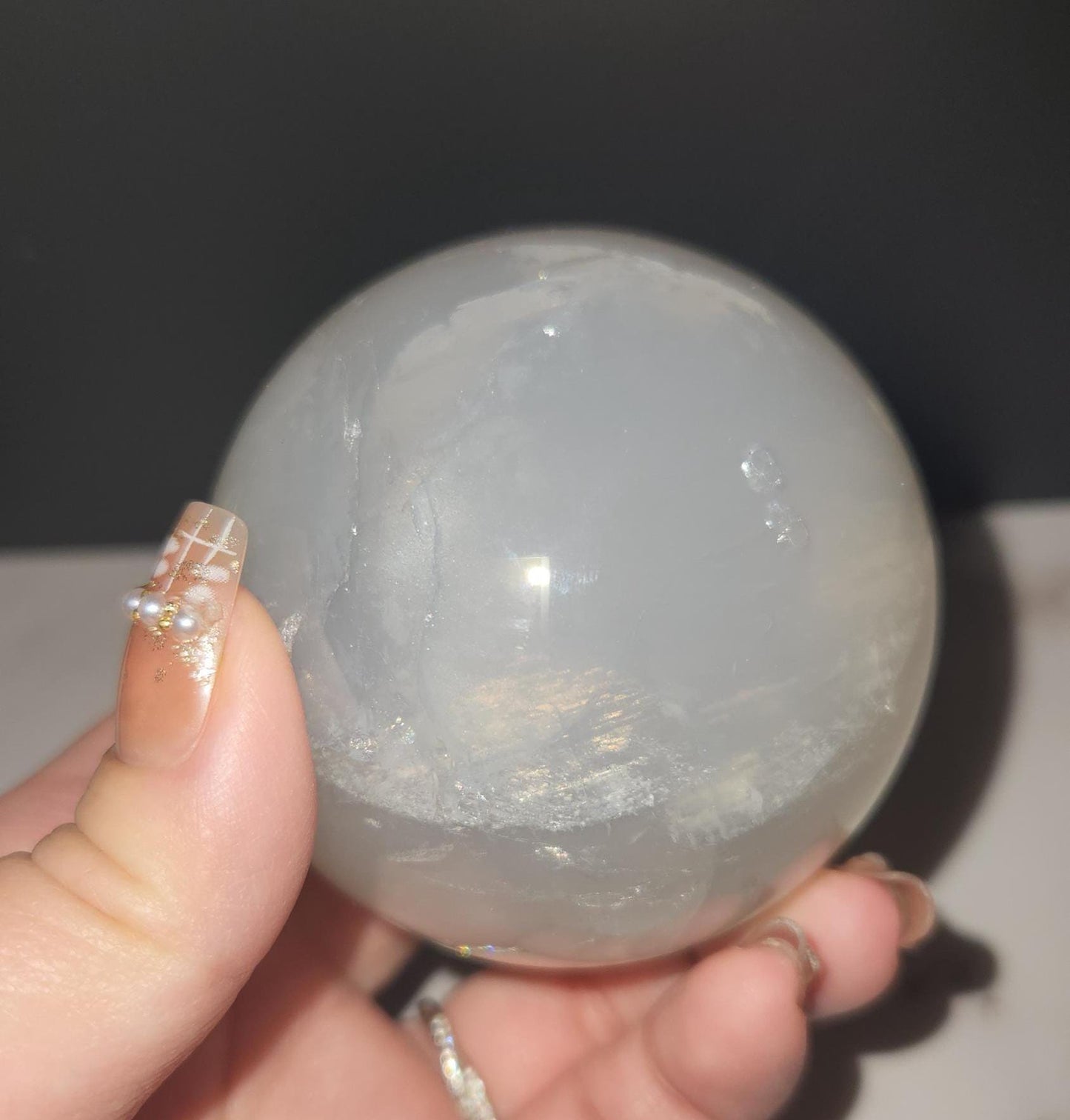 Beautiful blue rose quartz sphere with inclusions and rainbows 67.2mm