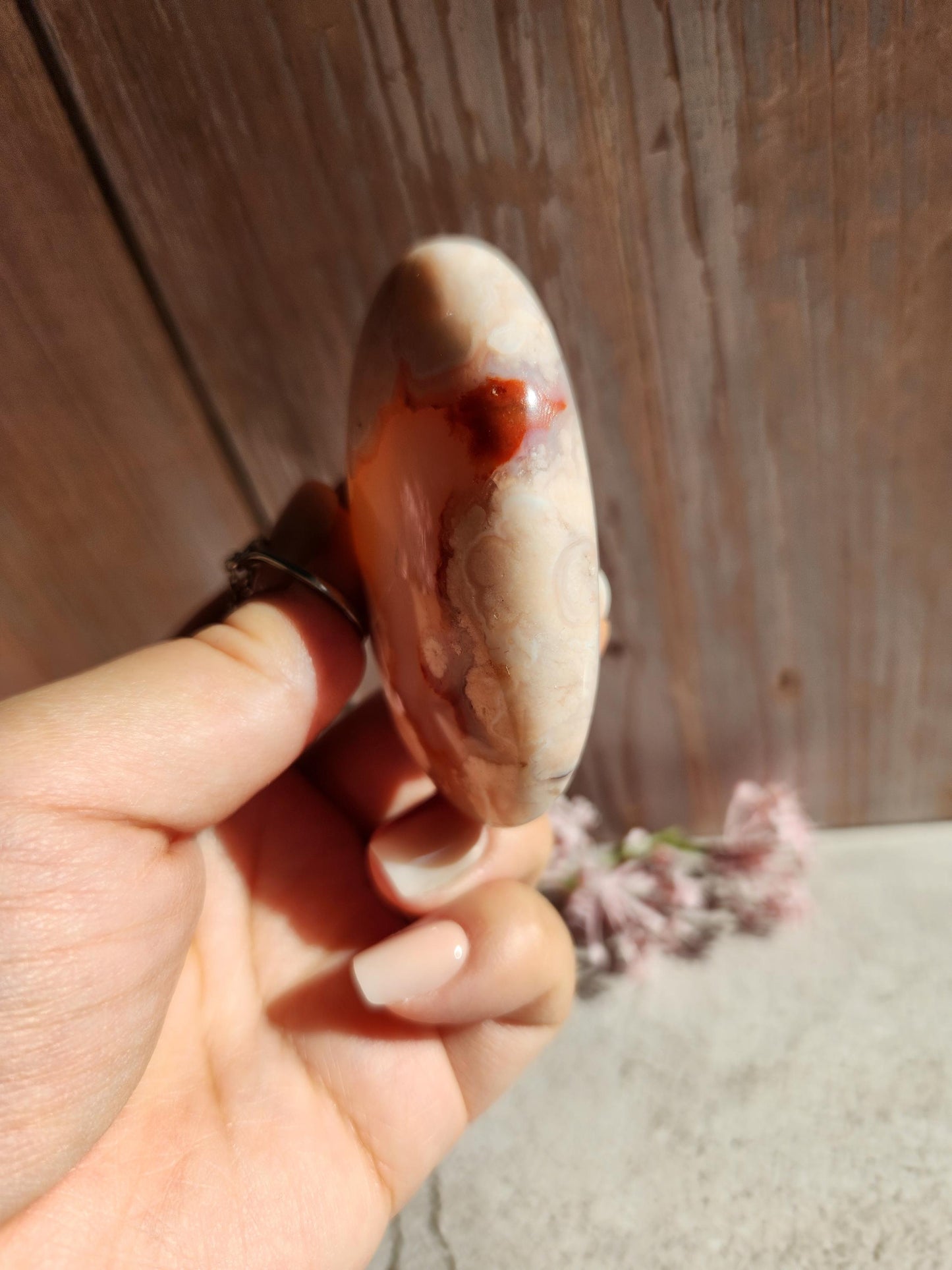 Beautiful natural carnelian flower agate palm stone with flowers, druzy and agate banding from Madagascar, cherry blossoms