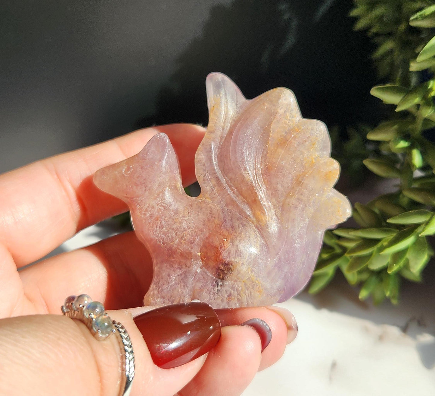 Natural fluorite 9 tail fox carving with golden healer inclusions