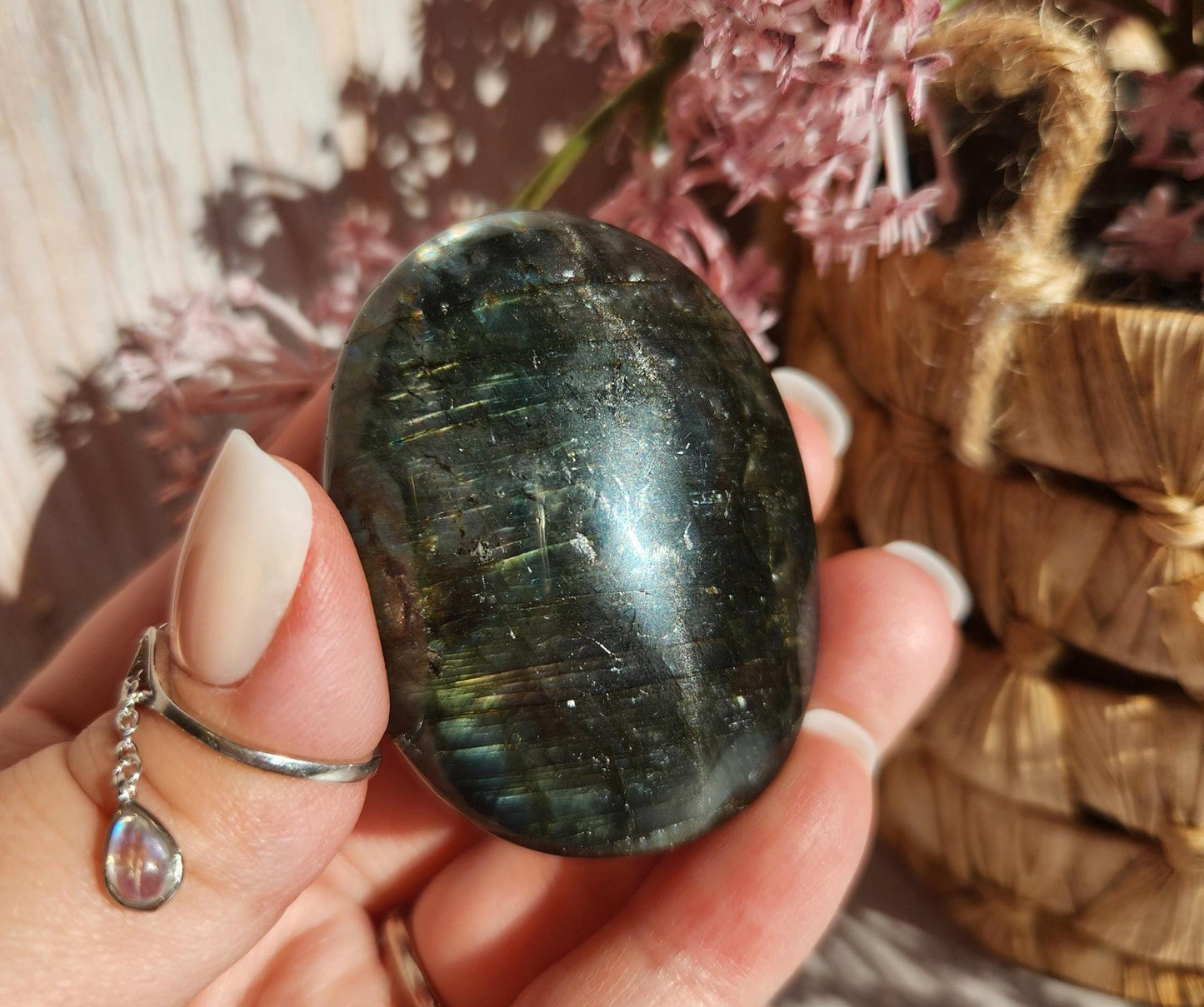 Beautiful bright silver and purple labradorite palm stone from Finland