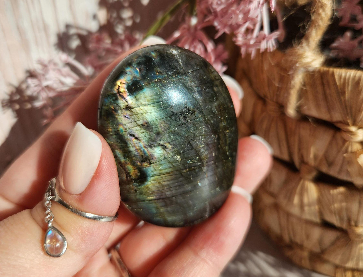 Beautiful bright silver and purple labradorite palm stone from Finland