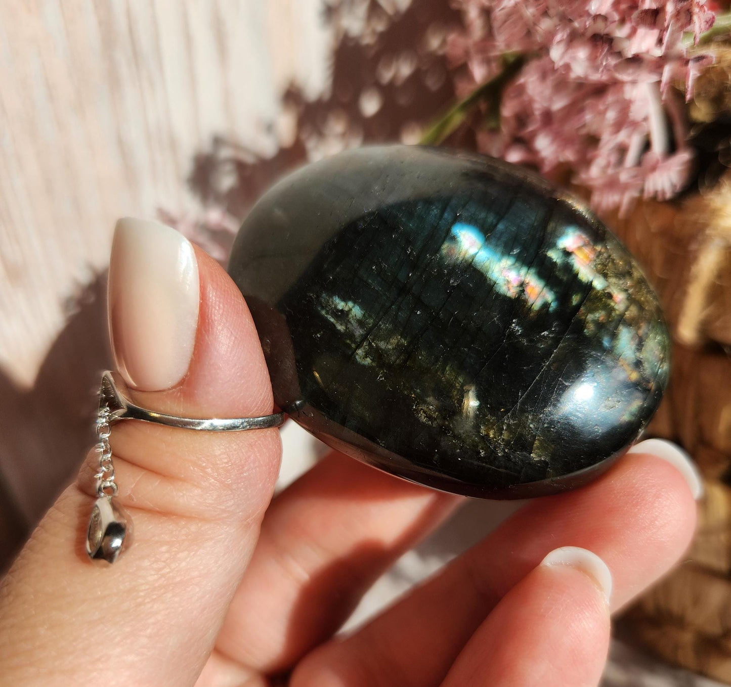 Beautiful bright silver and purple labradorite palm stone from Finland