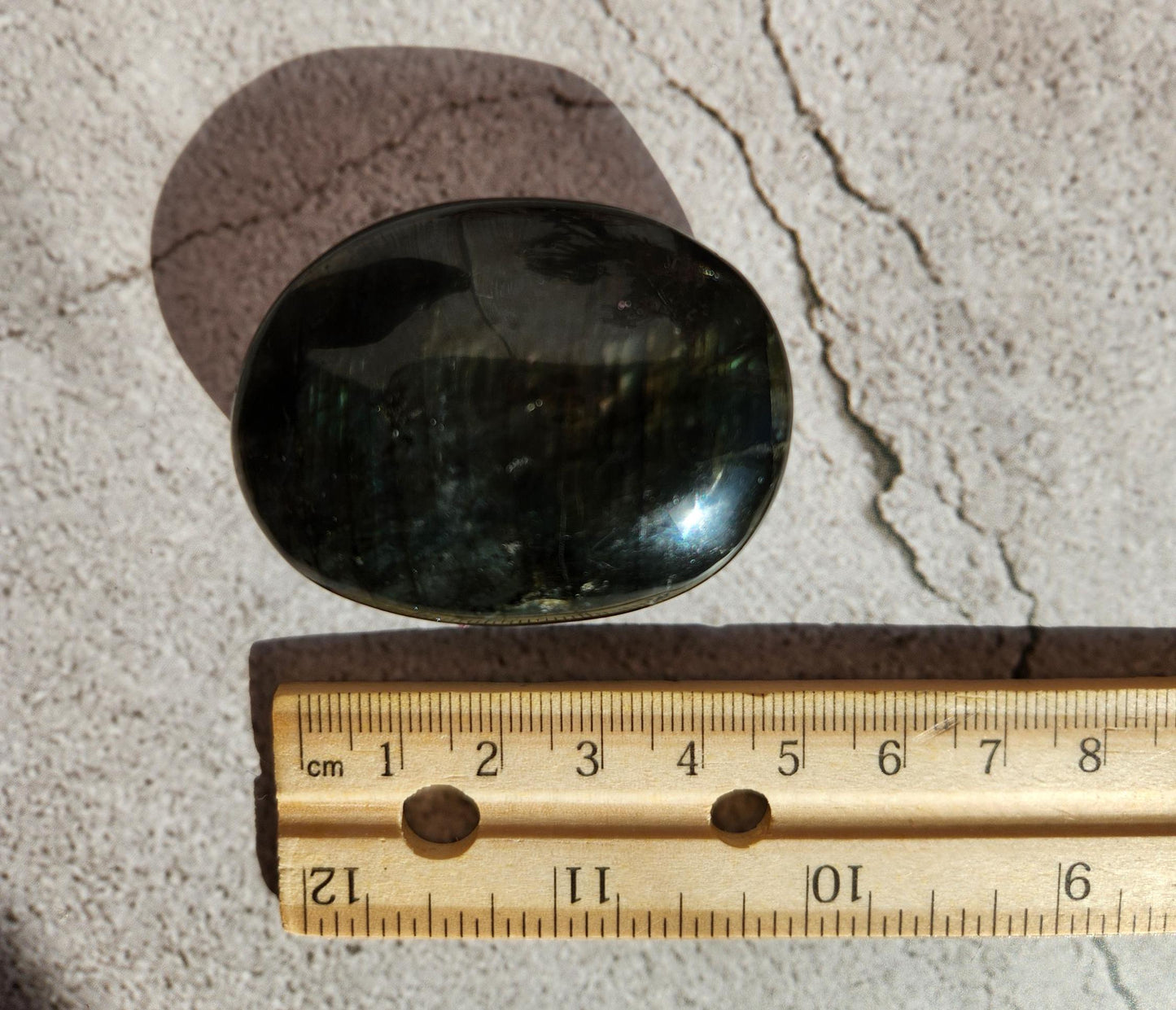 Beautiful bright silver and purple labradorite palm stone from Finland