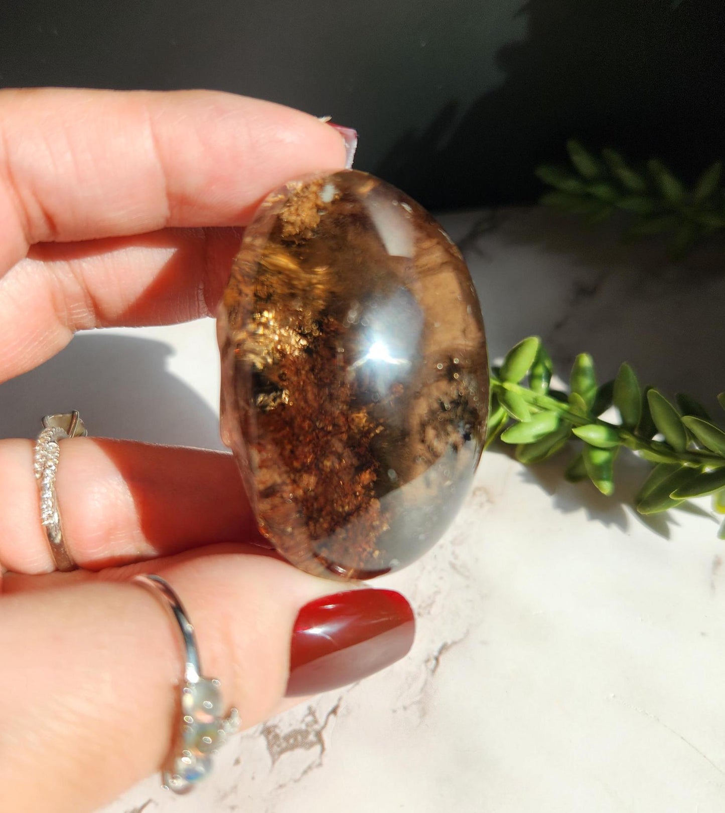 Natural smoky lodolite garden quartz lens from Brazil, half polish and half raw, with a beautiful rainbow