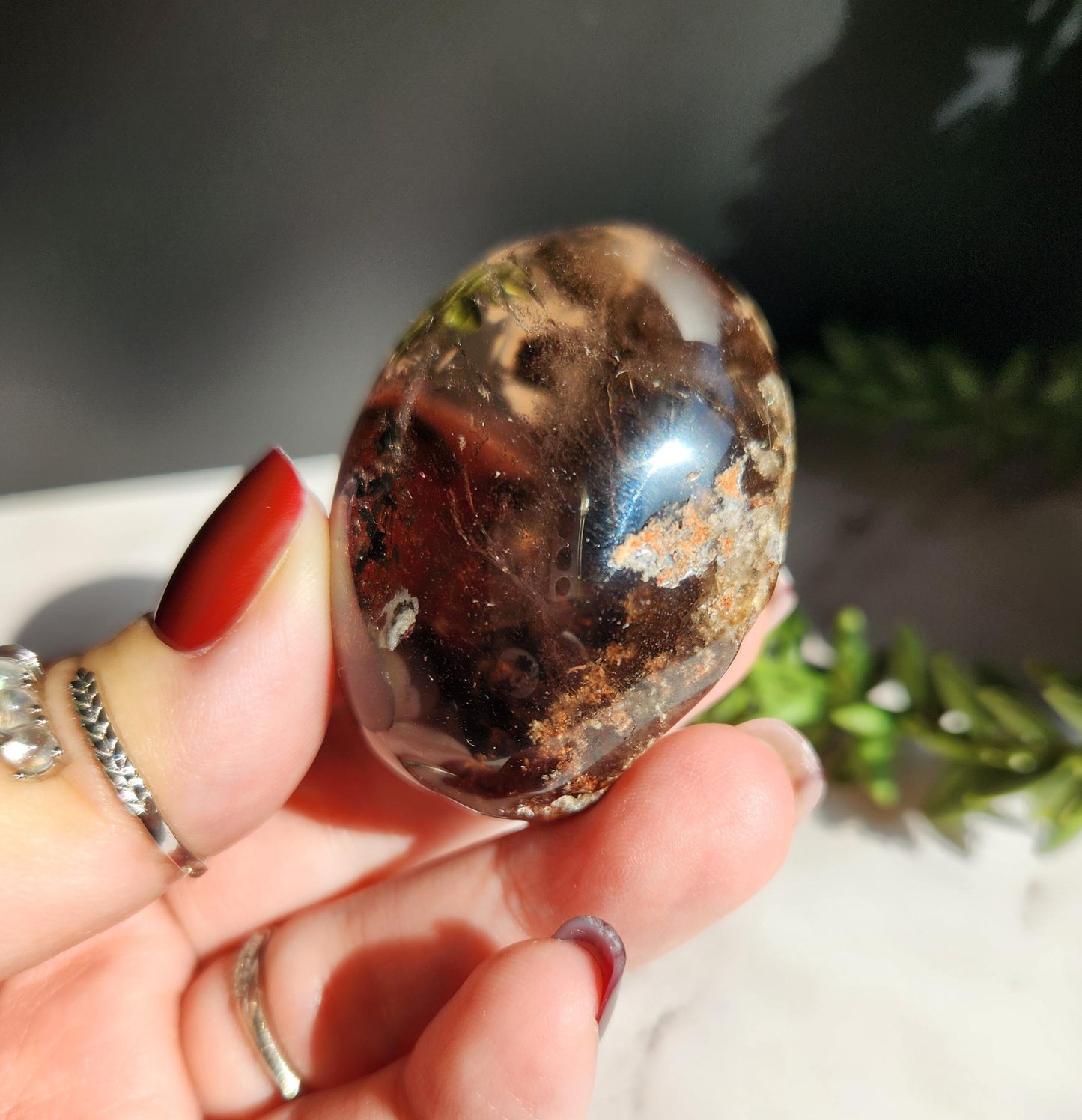Natural smoky lodolite garden quartz lens from Brazil, half polish and half raw, with a beautiful rainbow