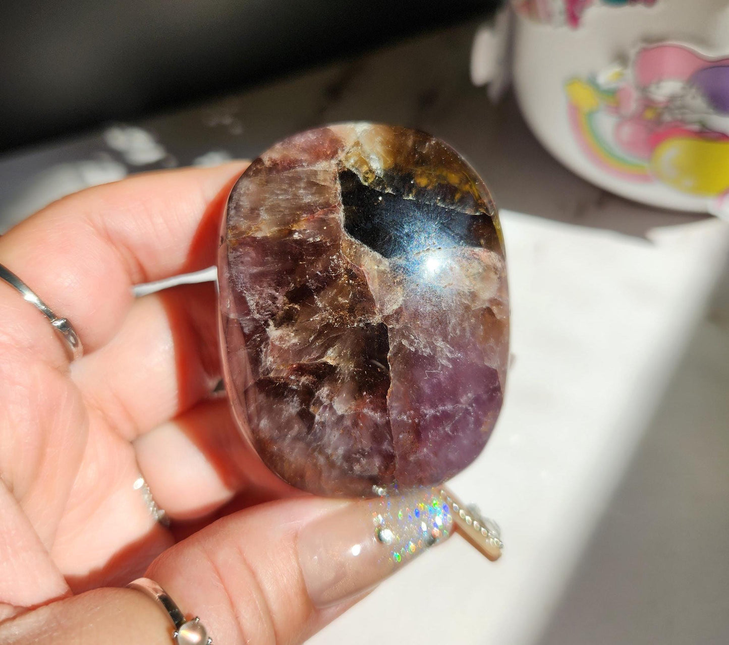 Rare natural super seven palm stone from Brazil 25E