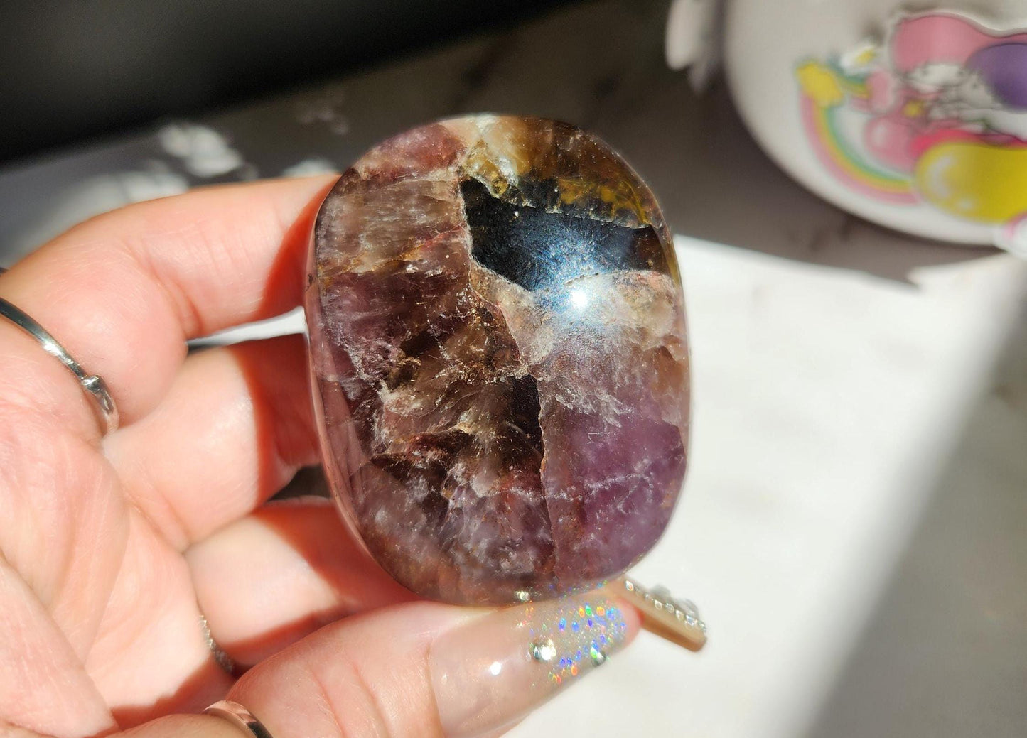 Rare natural super seven palm stone from Brazil 25E