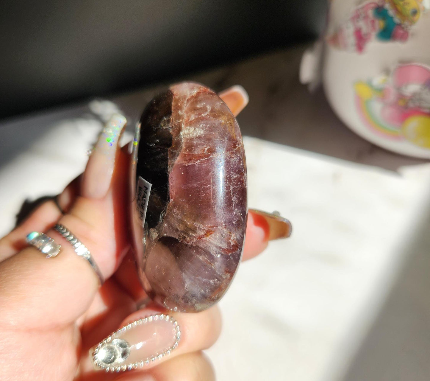 Rare natural super seven palm stone from Brazil 25E